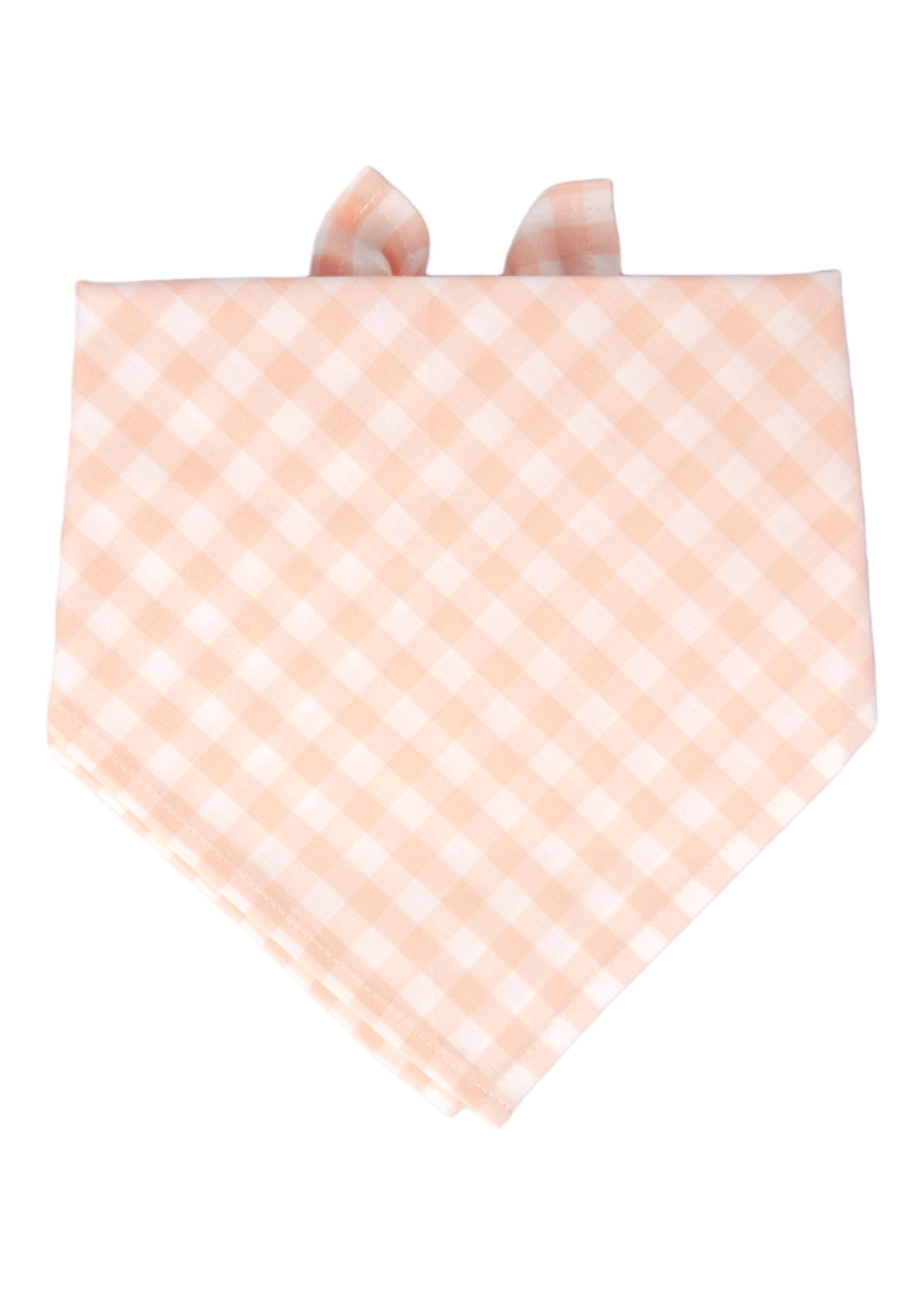 A soft cotton dog bandana in an apricot and white checkered pattern, folded in a classic triangle shape with neatly stitched edges and collar loops at the top for secure attachment—perfect for adding a sweet, stylish flair.
