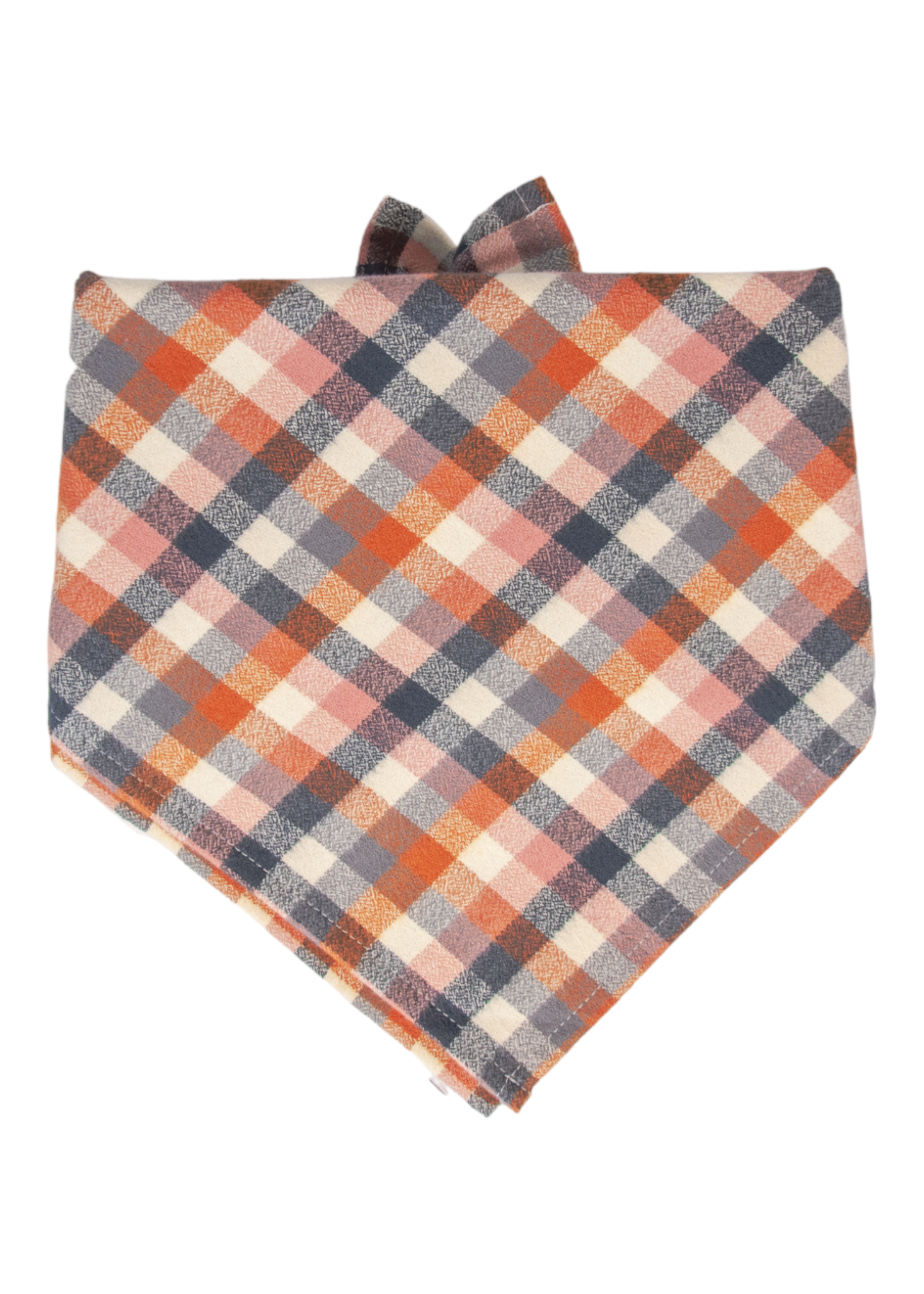 Dog bandana in a classic triangle fold with a warm fall plaid design. The bandana is made soft woven flannel fabric, with tied tips peeking from the top.