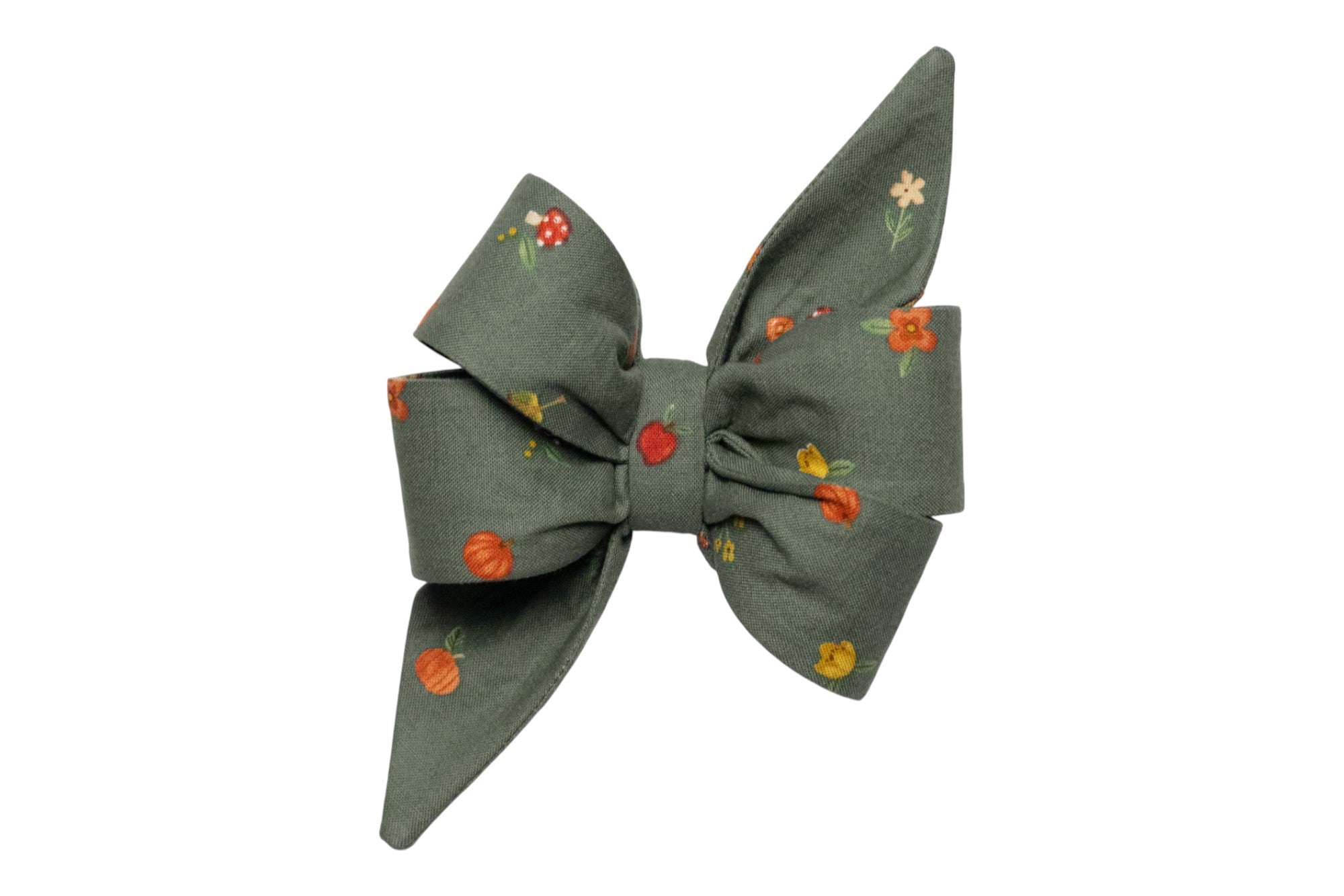 Oversized dog bow in forest green, adorned with a charming fall pattern of pumpkins, florals, mushrooms, and autumn leaves. With long, tapered tails and structured loops, this statement accessory adds elegant seasonal flair to any collar.