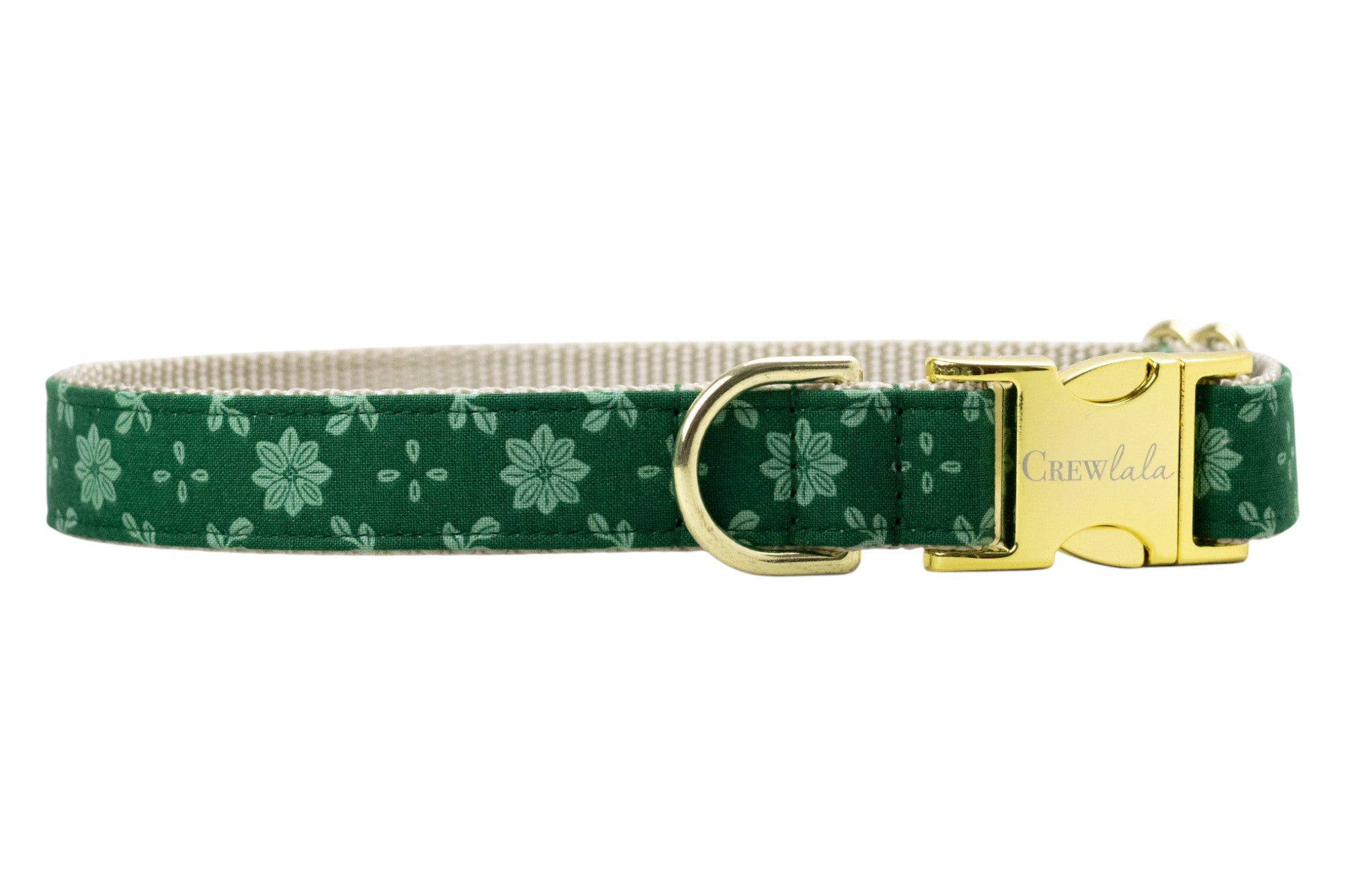 Floral dog collar crafted from green fabric with a light green symmetrical flower and dot pattern. The collar is constructed with a nylon woven backing and includes sleek hardware: a branded buckle with “Crewlala” text and a matching D-ring for attaching accessories.