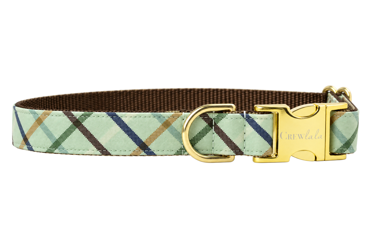 Plain Big Bear Plaid dog collar without the bow, made with a pale sage green fabric with a windowpane plaid of navy, dark green and tan lines, lined with dark brown nylon webbing and gold hardware with a Crewlala logo buckle.