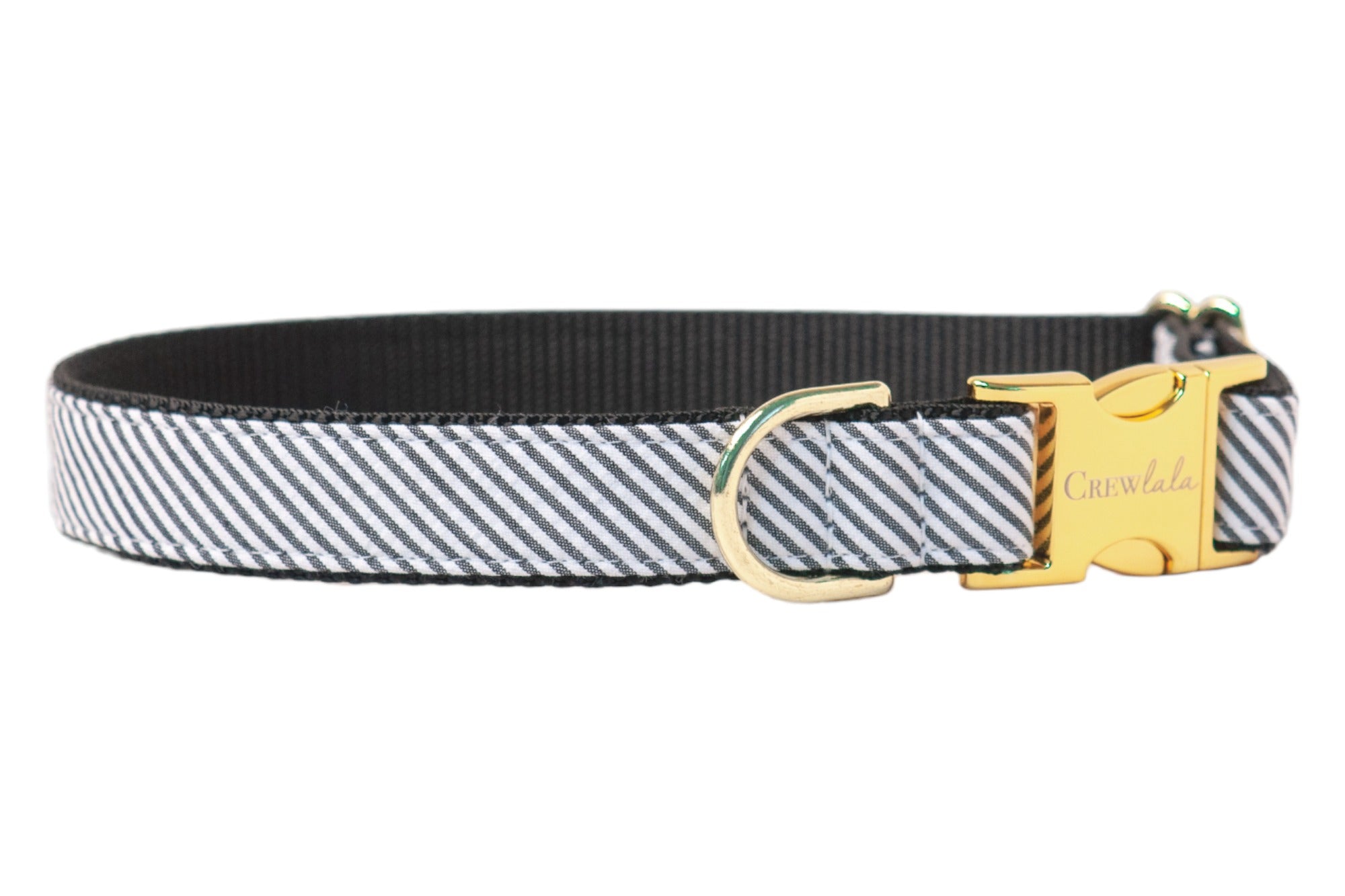 A crisp black-and-white seersucker collar with subtle texture and luxe accents, blending Southern style with durable comfort for everyday wear.