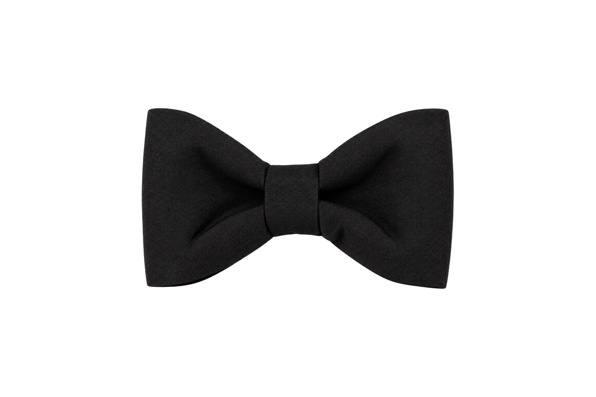 Classic dog bow tie in Black Tie Woven fabric, a solid black woven fabric with a subtle texture, with a matching fabric center knot, photographed on a white studio background.