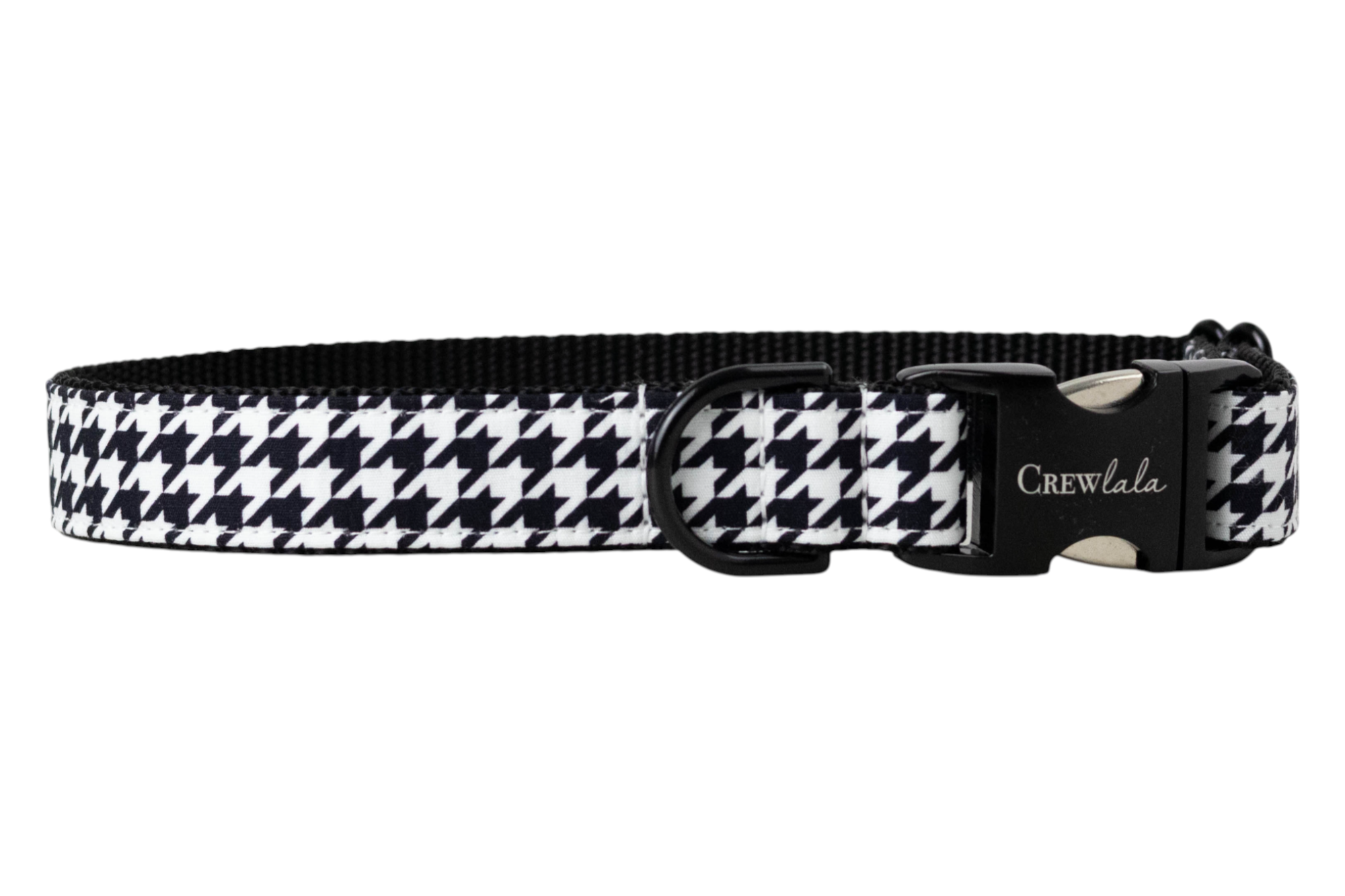 A dog collar with a classic black and white houndstooth pattern on the outer band and a solid black woven interior. The collar features a black metal side-release buckle engraved with the brand “Crew LaLa” and a black D-ring for leash attachment.
