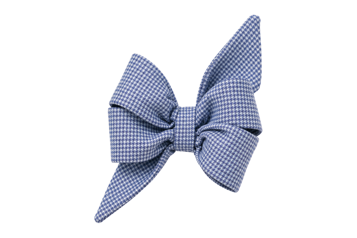 Standalone belle bow in Blue Houndstooth fabric, a fine periwinkle blue and white mini houndstooth check, with full upright loops and two pointed tails, photographed on a white studio background.