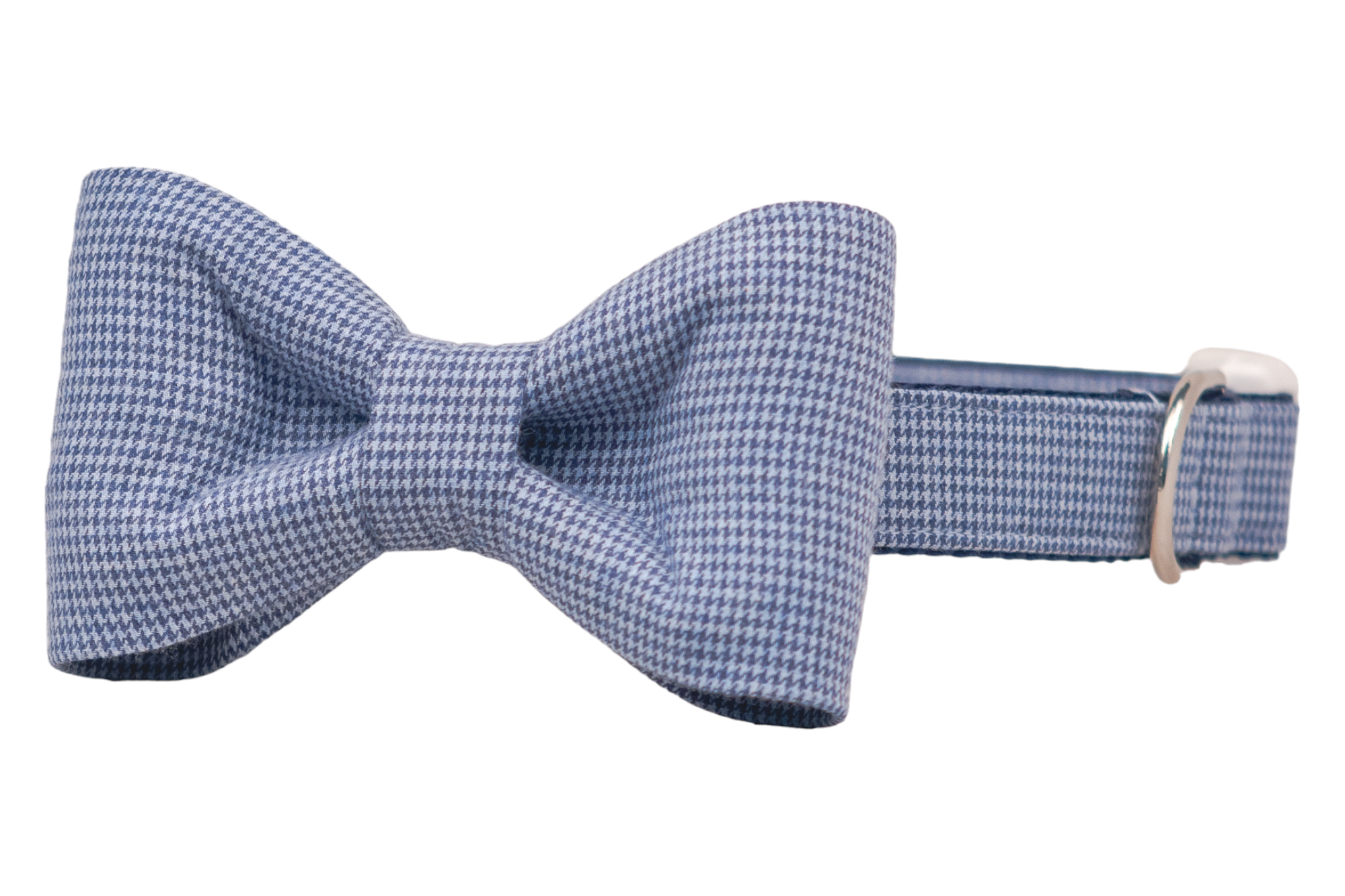 Dog collar with an attached classic bow tie in a navy blue and light blue houndstooth pattern. The structured bow tie is neatly centered, and the collar includes metal hardware for leash attachment and size adjustment.