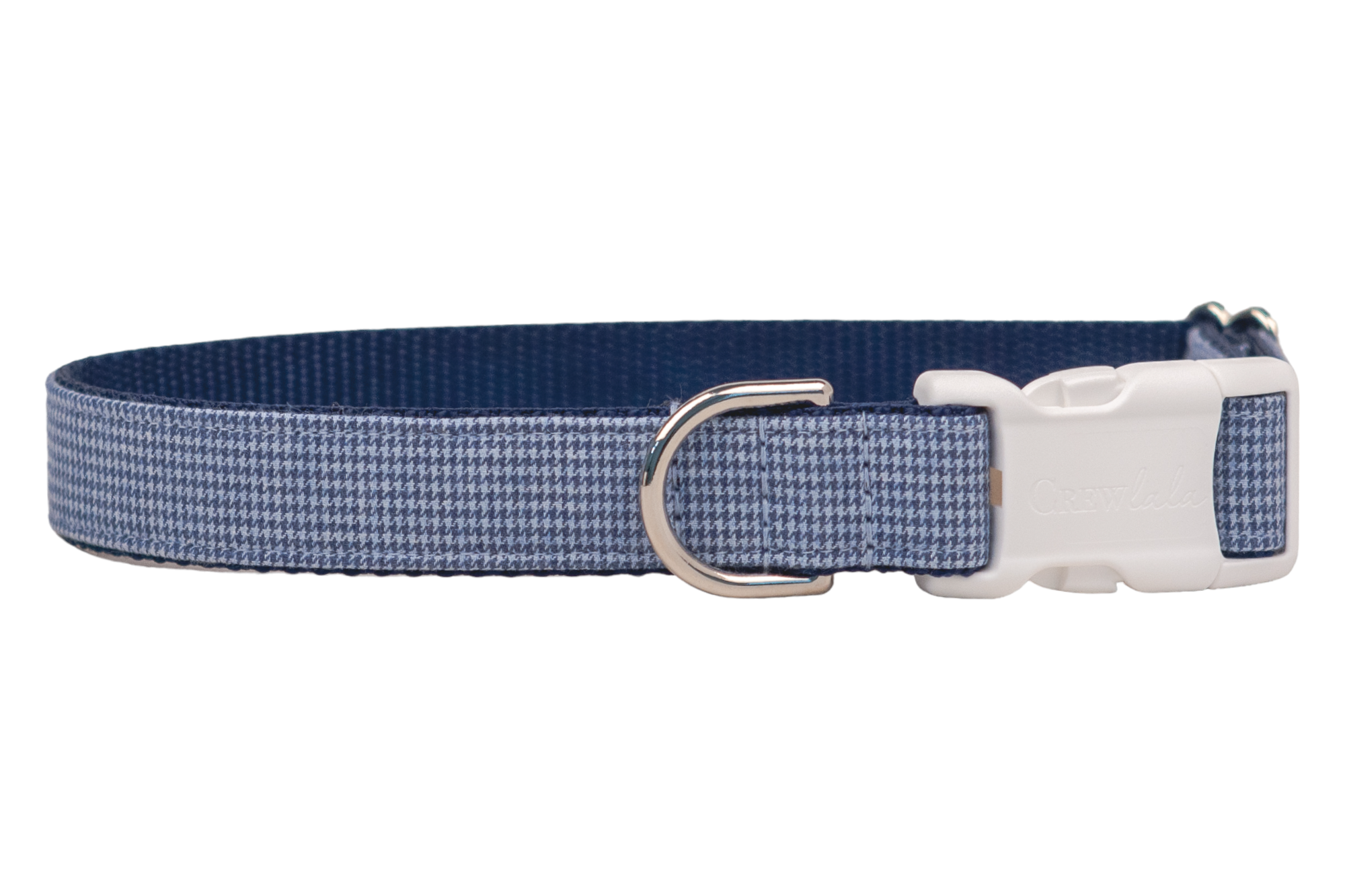 Adjustable dog collar featuring a blue and light blue houndstooth fabric overlay on durable navy webbing. The collar includes a plastic side-release buckle engraved with “Crewlala” and a metal D-ring for leash attachment.