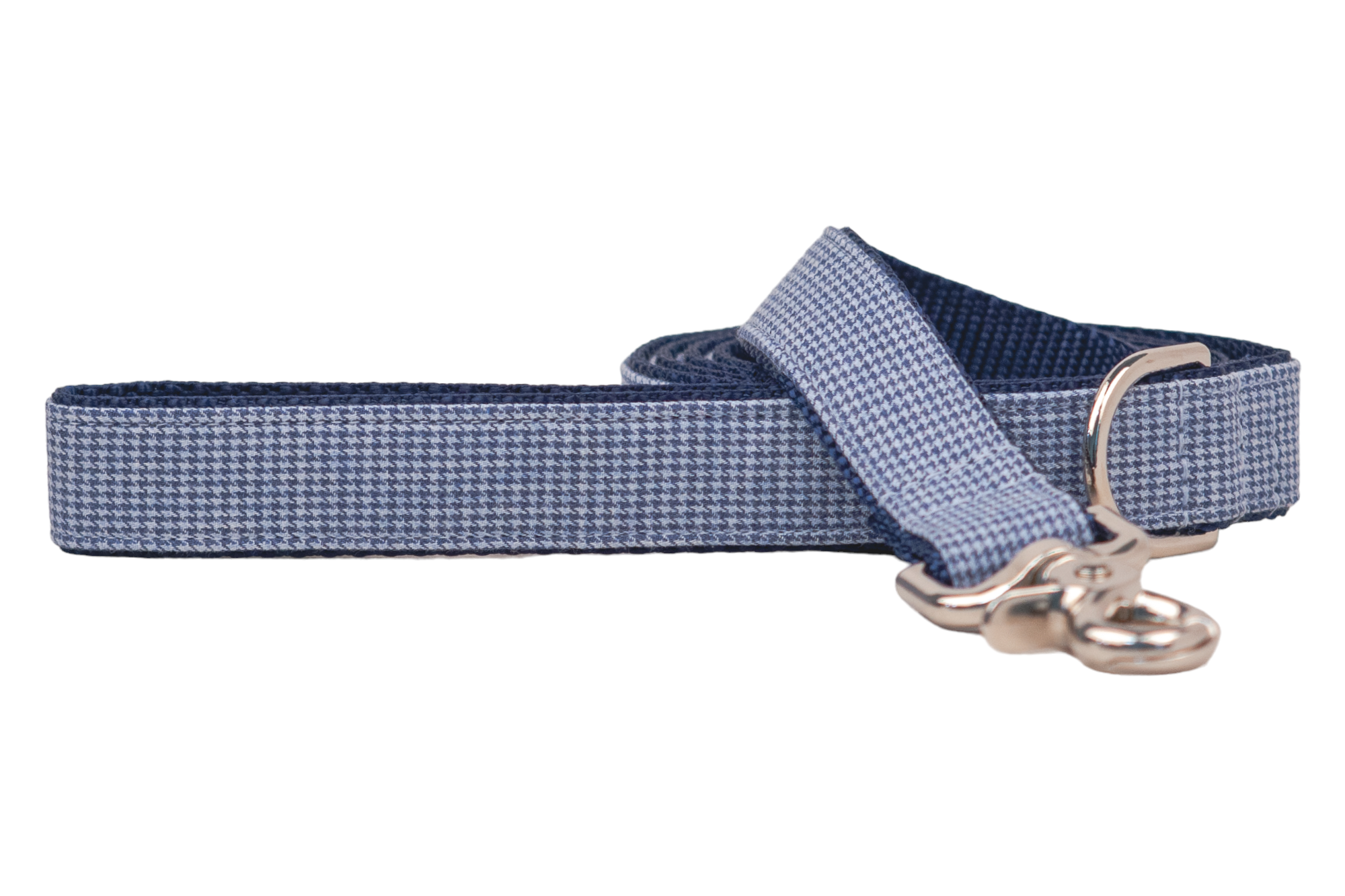 Stylish dog leash featuring a classic houndstooth print in two shades of blue, backed with durable navy webbing. The leash is coiled with the clasp end visible, showcasing a shiny metal hook and attached D-ring.