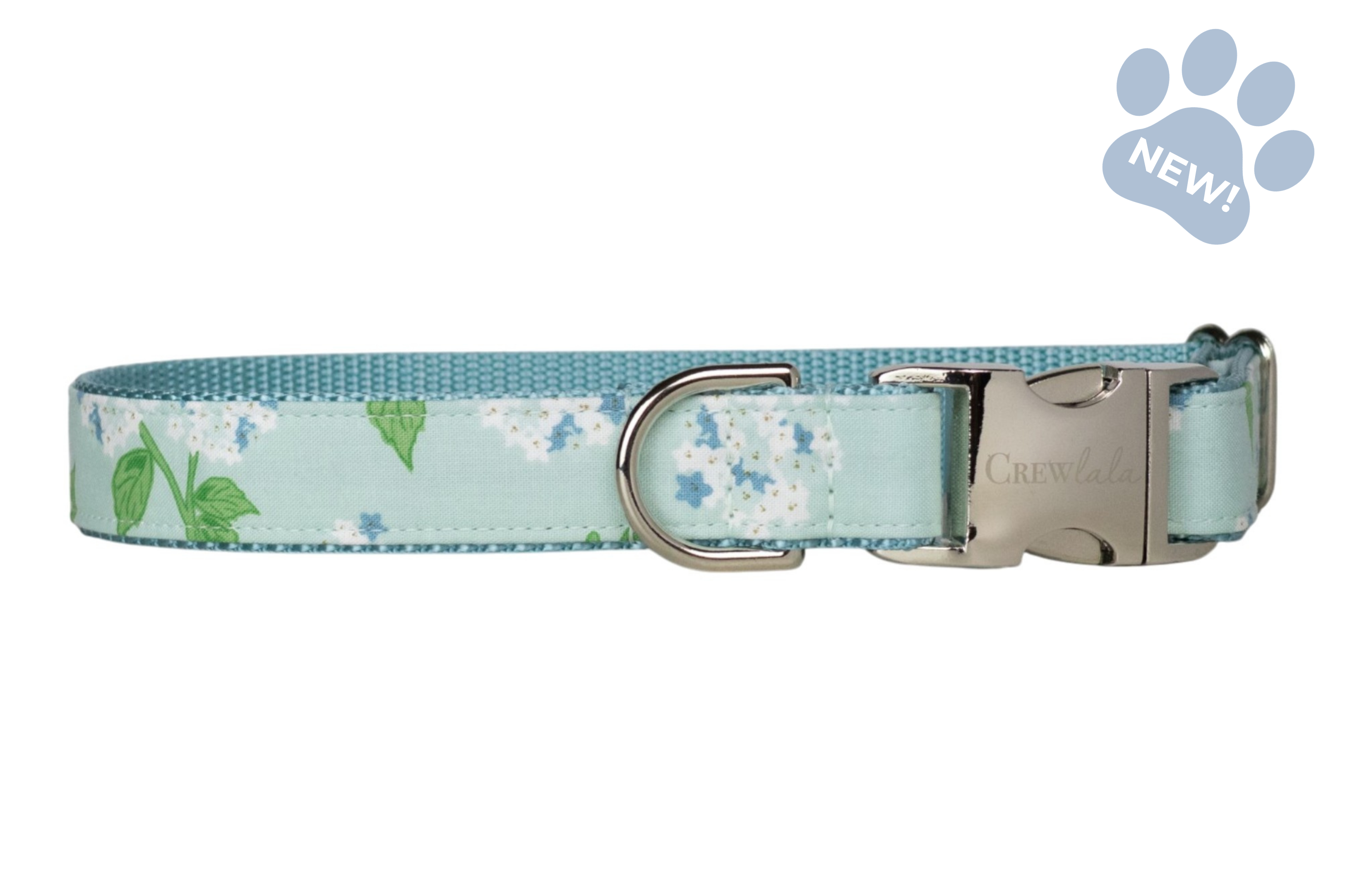 Adjustable dog collar featuring a soft mint blue background with white hydrangea blooms, blue floral accents, and green leaves, finished with silver-tone hardware and matching blue webbing.