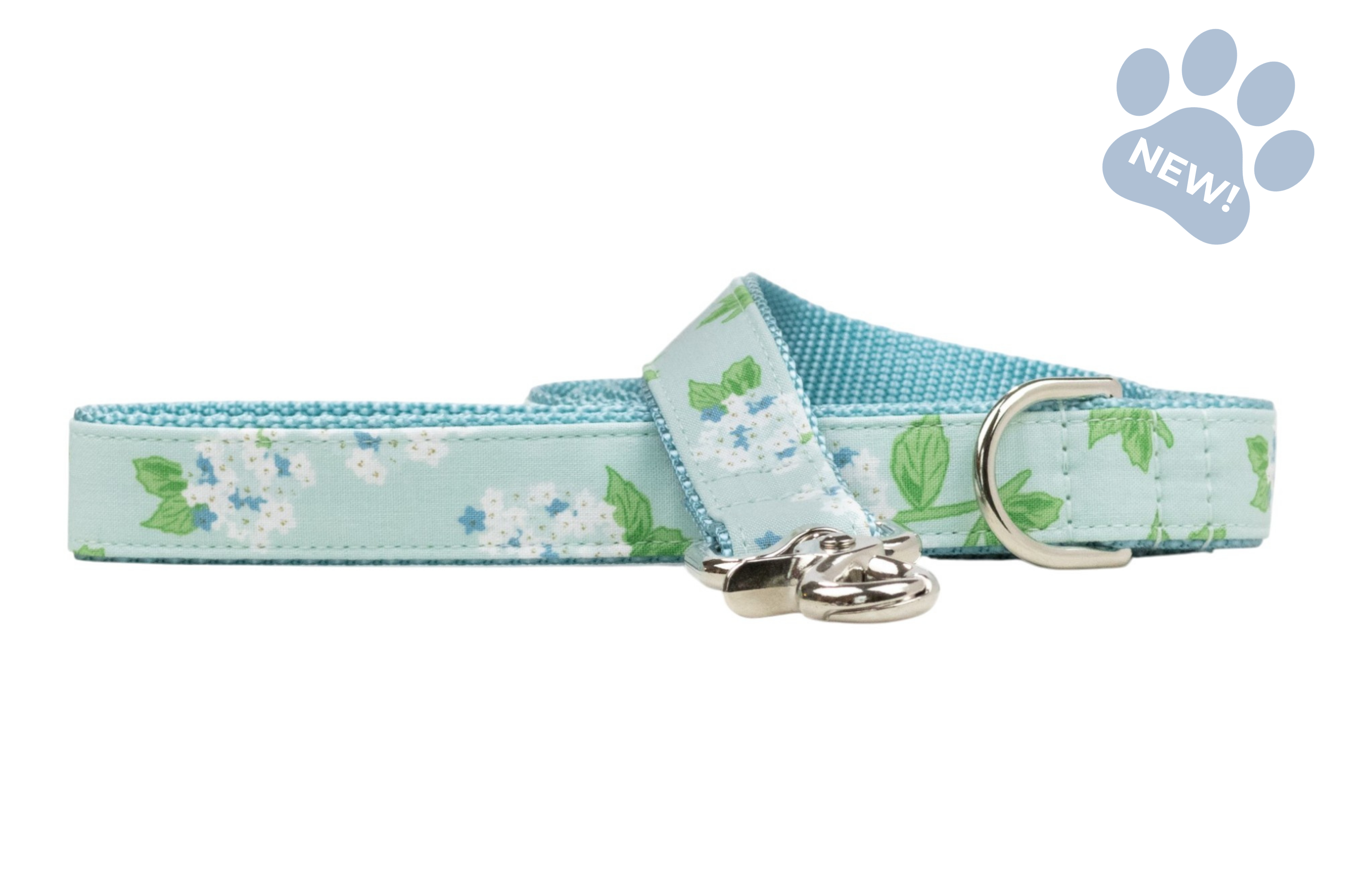Mint blue floral dog leash featuring a hydrangea-inspired print with white flower clusters, small blue blossoms, and green leaves. The leash includes a silver swivel clasp and matching fabric loop, displayed flat with a “New!” paw graphic in the upper-right corner.