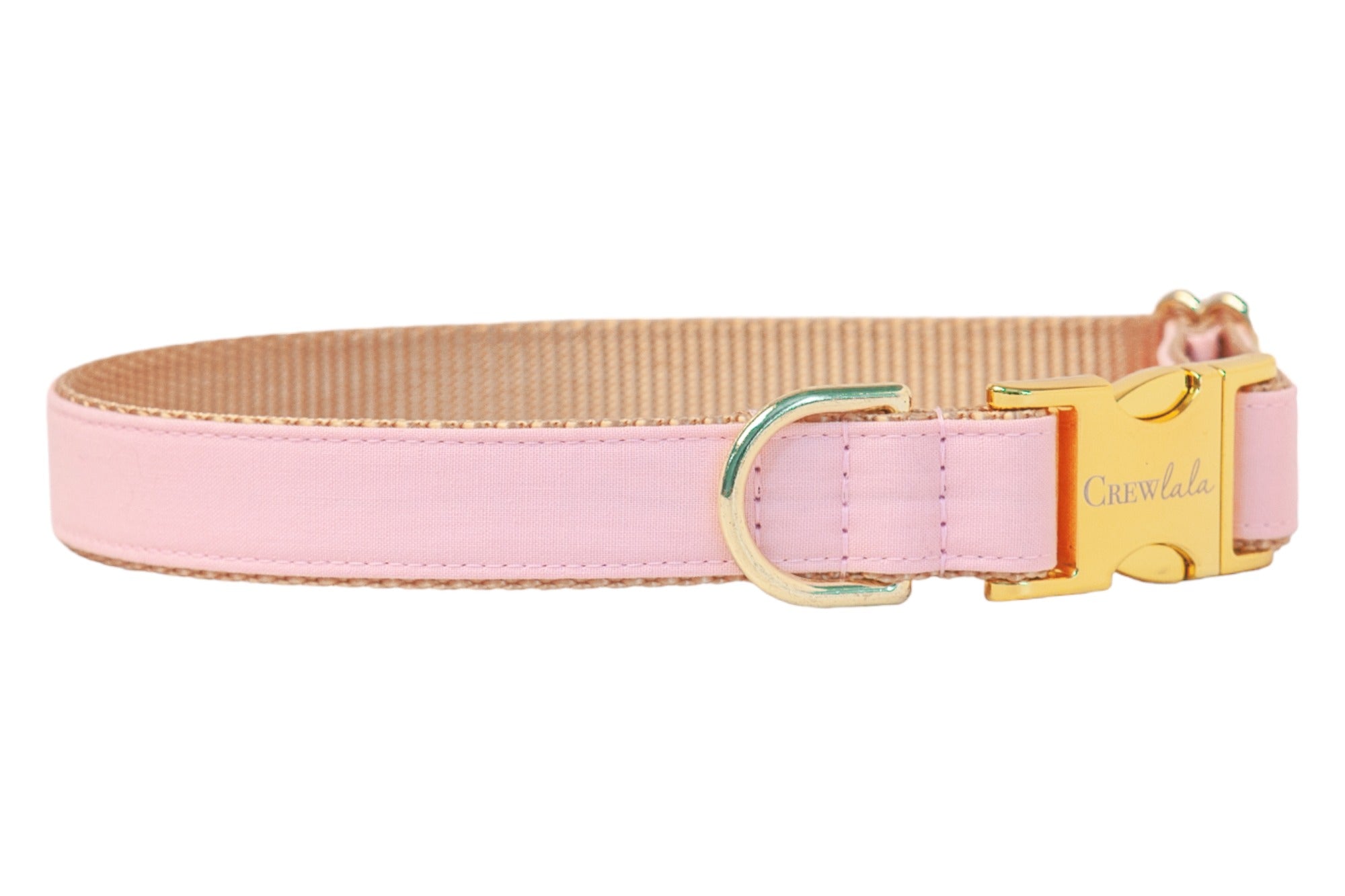 A light pink dog collar with a tan woven interior and shiny gold hardware, including a D-ring and a side-release buckle engraved with “Crew LaLa,” displayed against a white background.