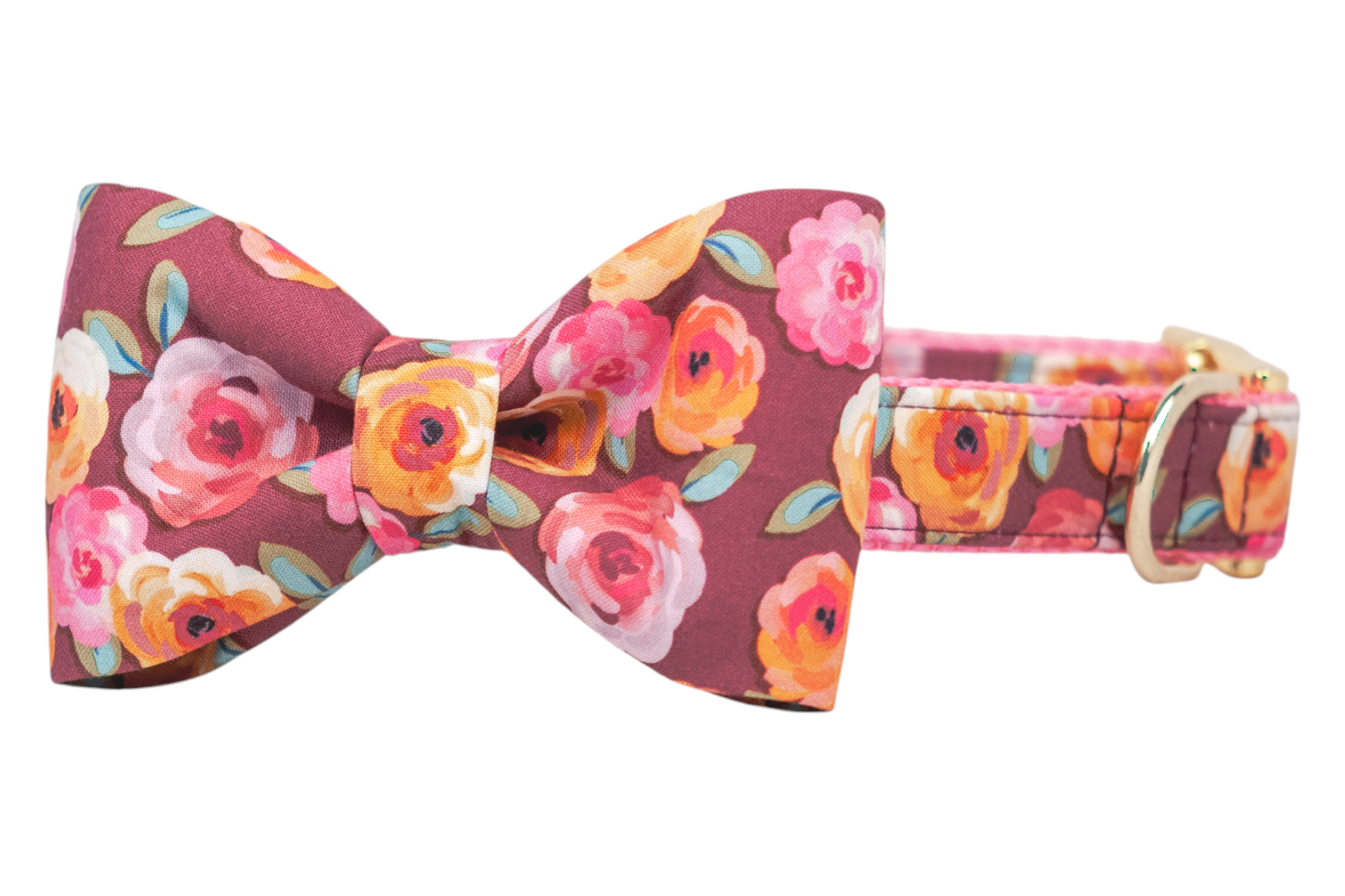 Floral dog collar with a classic bow tie attached, showcasing colorful rose blossoms in warm fall tones over a burgundy base. A shiny metal D-ring and buckle add a polished touch to this cheerful, eye-catching accessory.