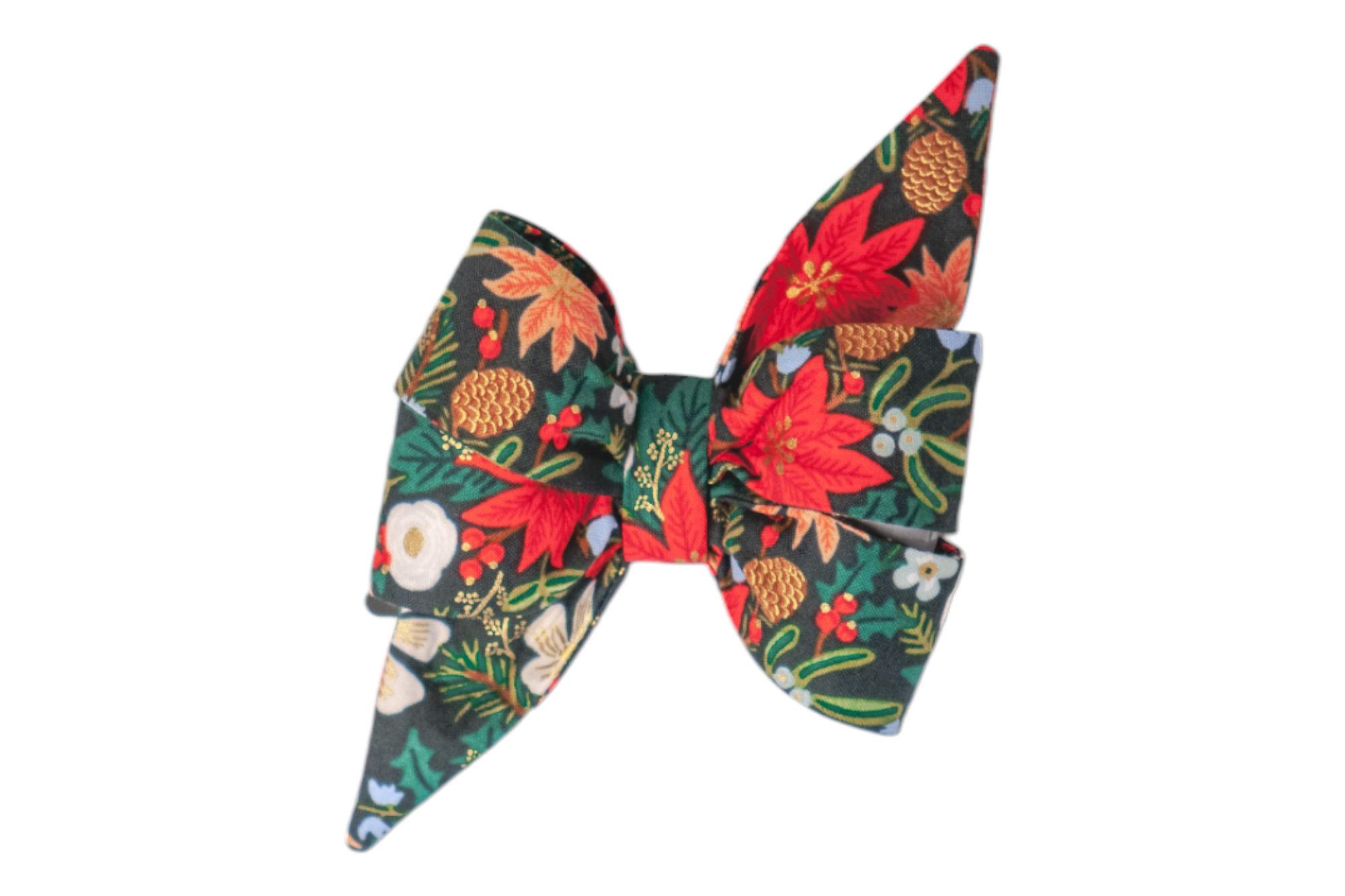Festive dog belle bow with a dramatic, pointed silhouette, crafted from fabric printed with classic holiday florals. The design includes bold poinsettias, light colored flowers, pinecones, and green foliage, highlighted with delicate metallic detailing for a seasonal sparkle.