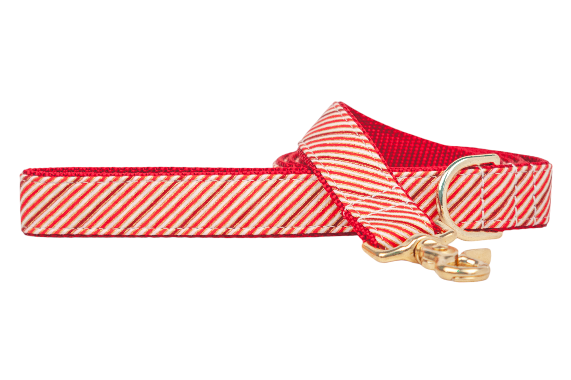 A festive dog leash with diagonal red, stripes, giving it a candy cane–inspired look. The leash is lined with red woven nylon webbing for durability and finished with polished hardware, including a swivel clasp and a D-ring near the handle.