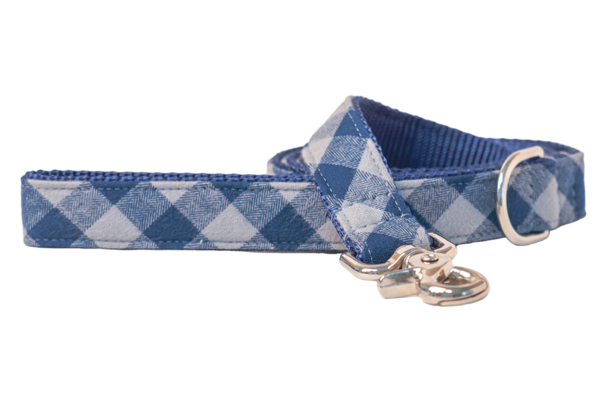 A stylish blue gingham flannel dog leash with a traditional check pattern, reinforced with woven navy webbing and metal hardware.