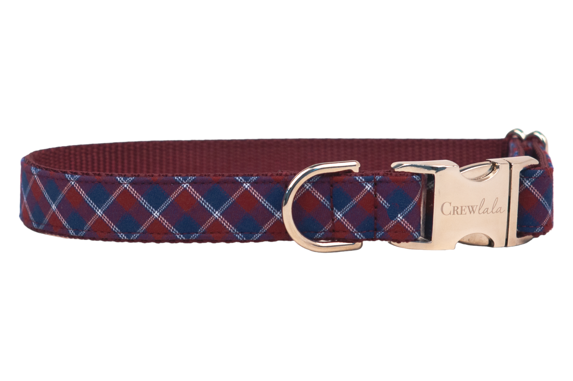 Dog collar with a burgundy red and navy blue argyle plaid pattern, featuring metal hardware, a matching D-ring, and a buckle engraved with the brand name “Crewlala.”