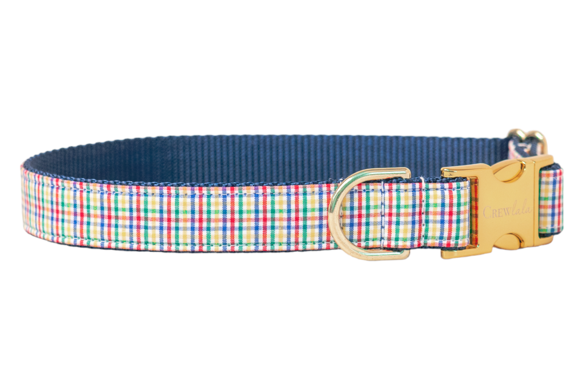 Dog collar with a multicolor plaid fabric overlay stitched to nylon webbing. The collar includes a metal D-ring for leash attachment and a buckle engraved with "Crewlala" branding, blending style with durability.