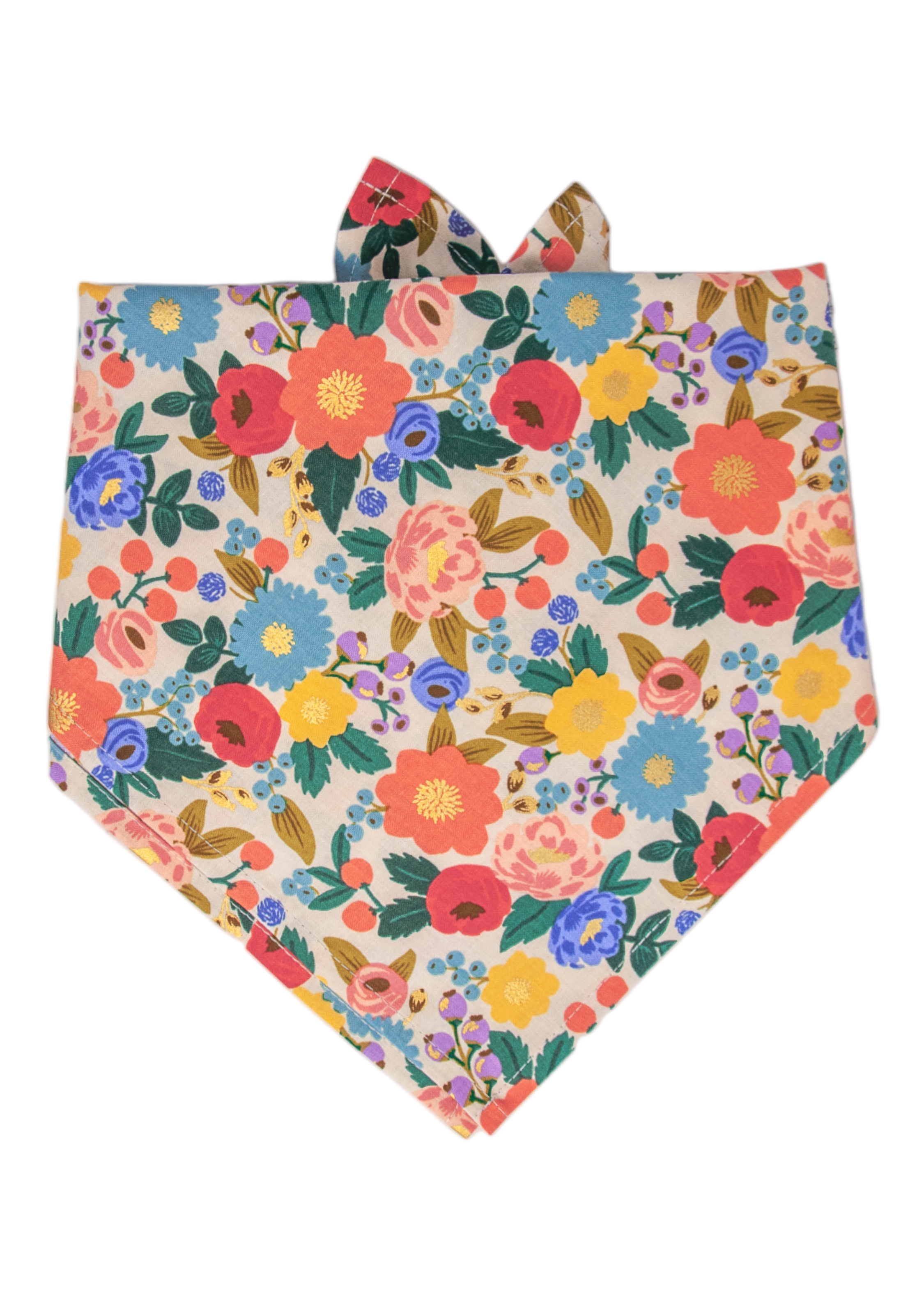 Dog bandana with an all-over floral print on a cream background, featuring vivid flowers mixed with leaves and berry clusters. The design includes subtle metallic foil details on some petals, and the bandana is tied at the top.