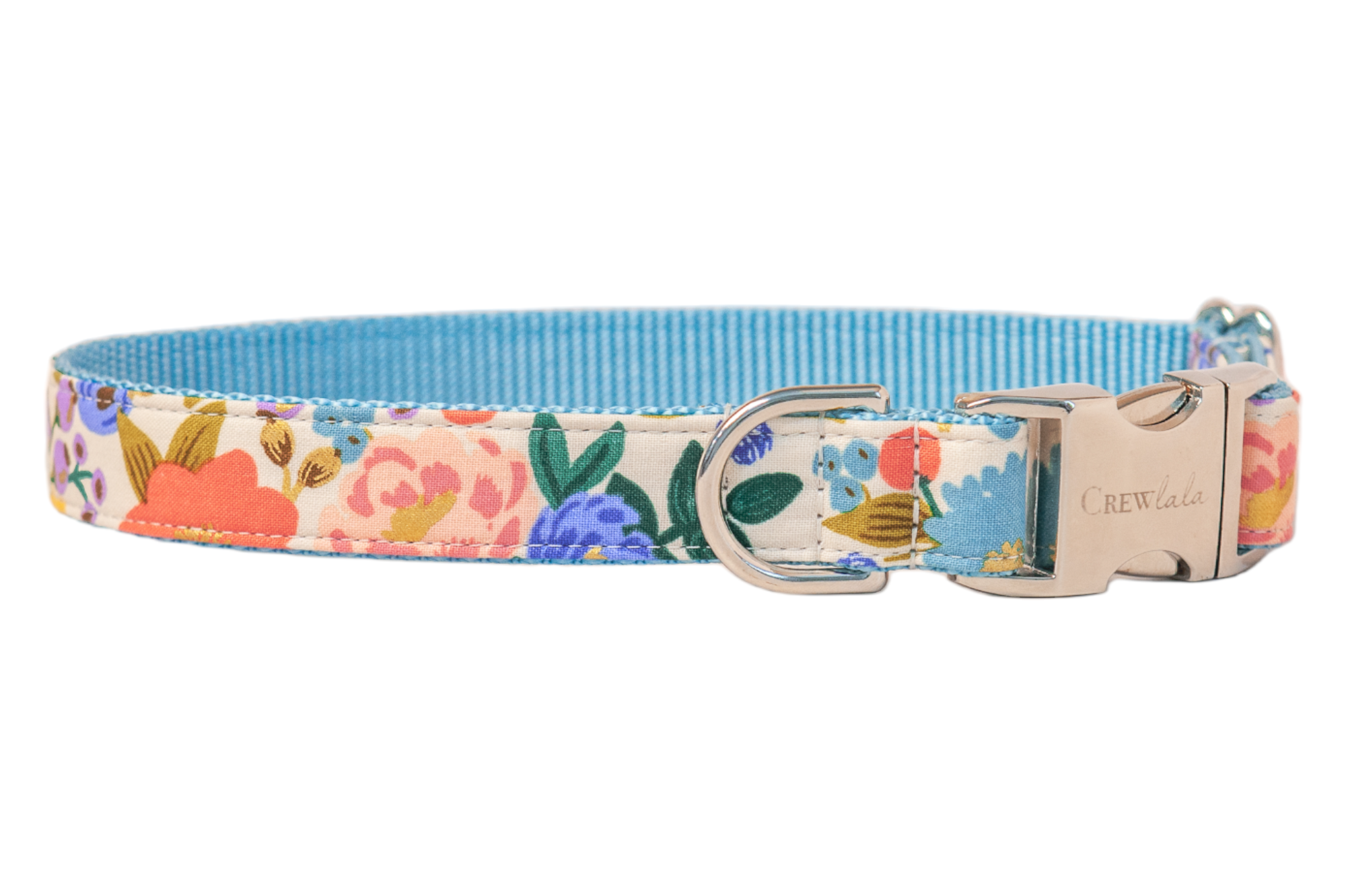 Dog collar with a colorful floral pattern on a cream background, featuring flowers with leaves and metallic detailing. The collar has a vibrant nylon underside and metal hardware, including a side-release buckle engraved with “Crewlala” and a D-ring.