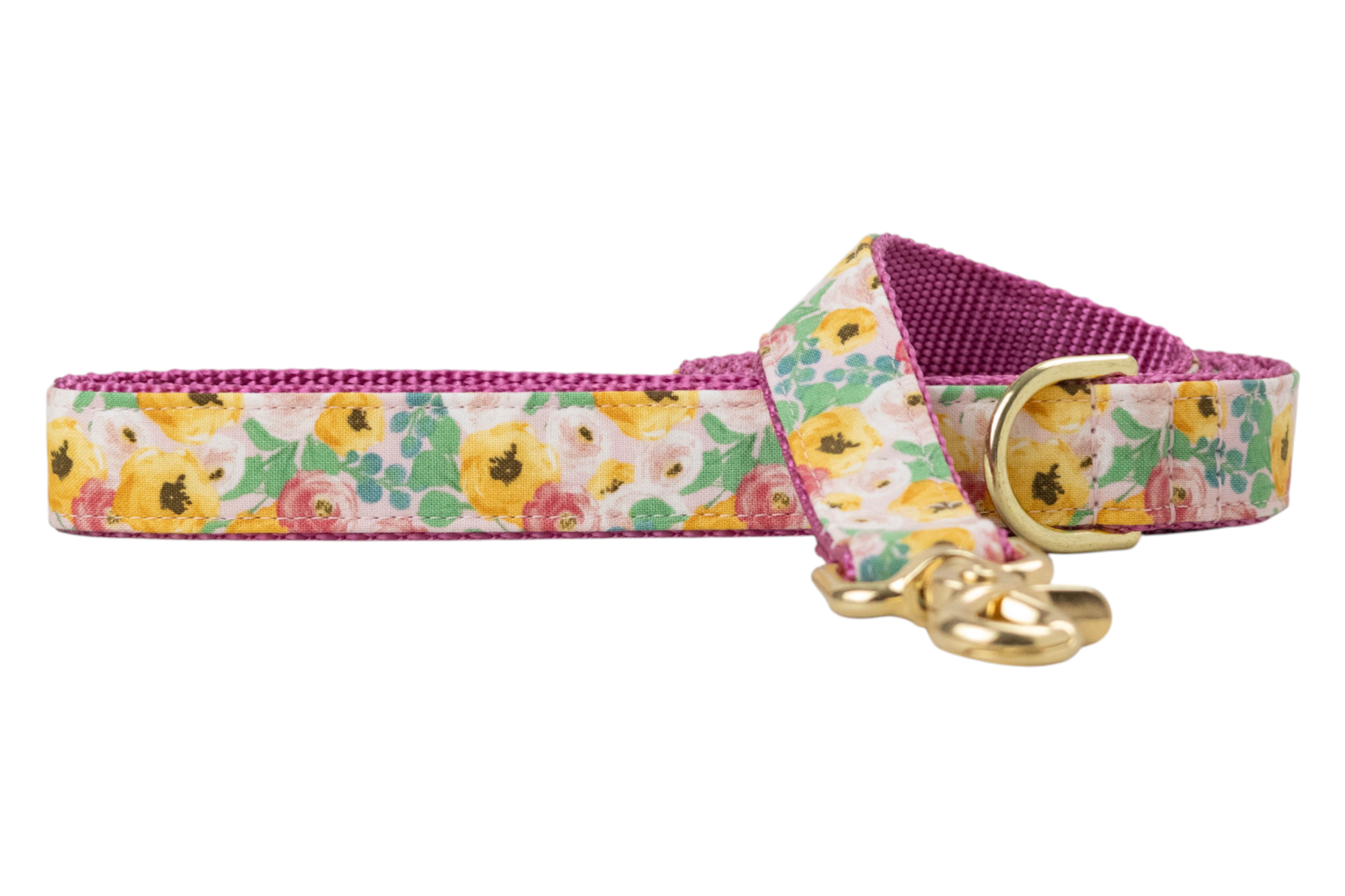 Floral dog leash with a multicolored bloom print on fabric backed by a woven webbing. The leash is finished with metal hardware, including a swivel clasp and D-ring for attachments.
