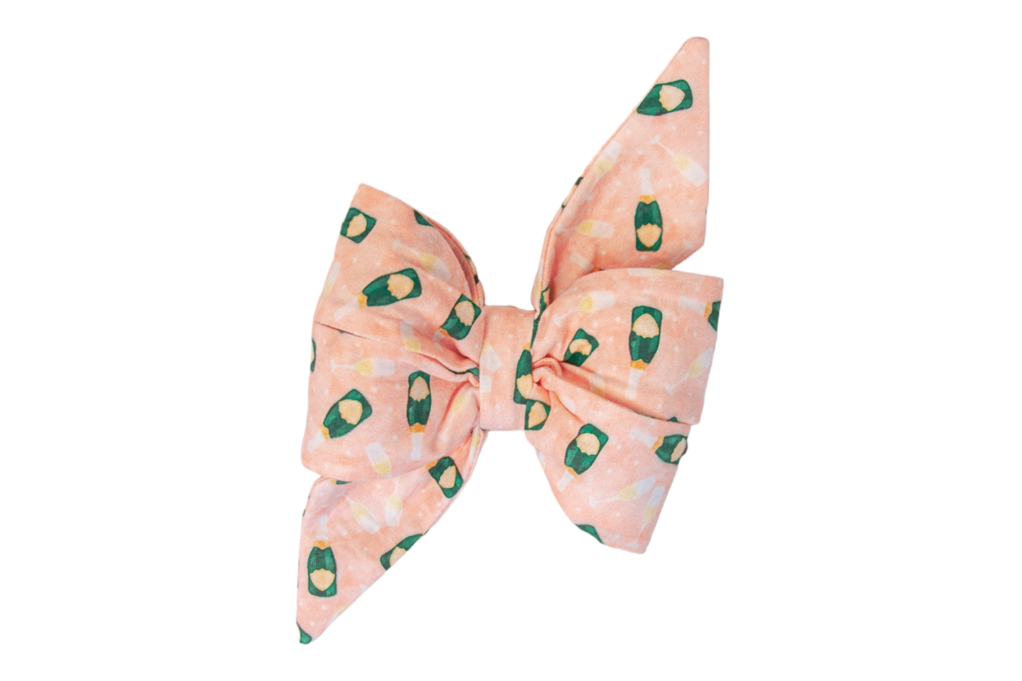 Party-themed belle bow accessory in a soft pink shade, featuring a whimsical repeating pattern of champagne bottles and glasses. The belle bow has full loops and sharp angled tails for a chic look.