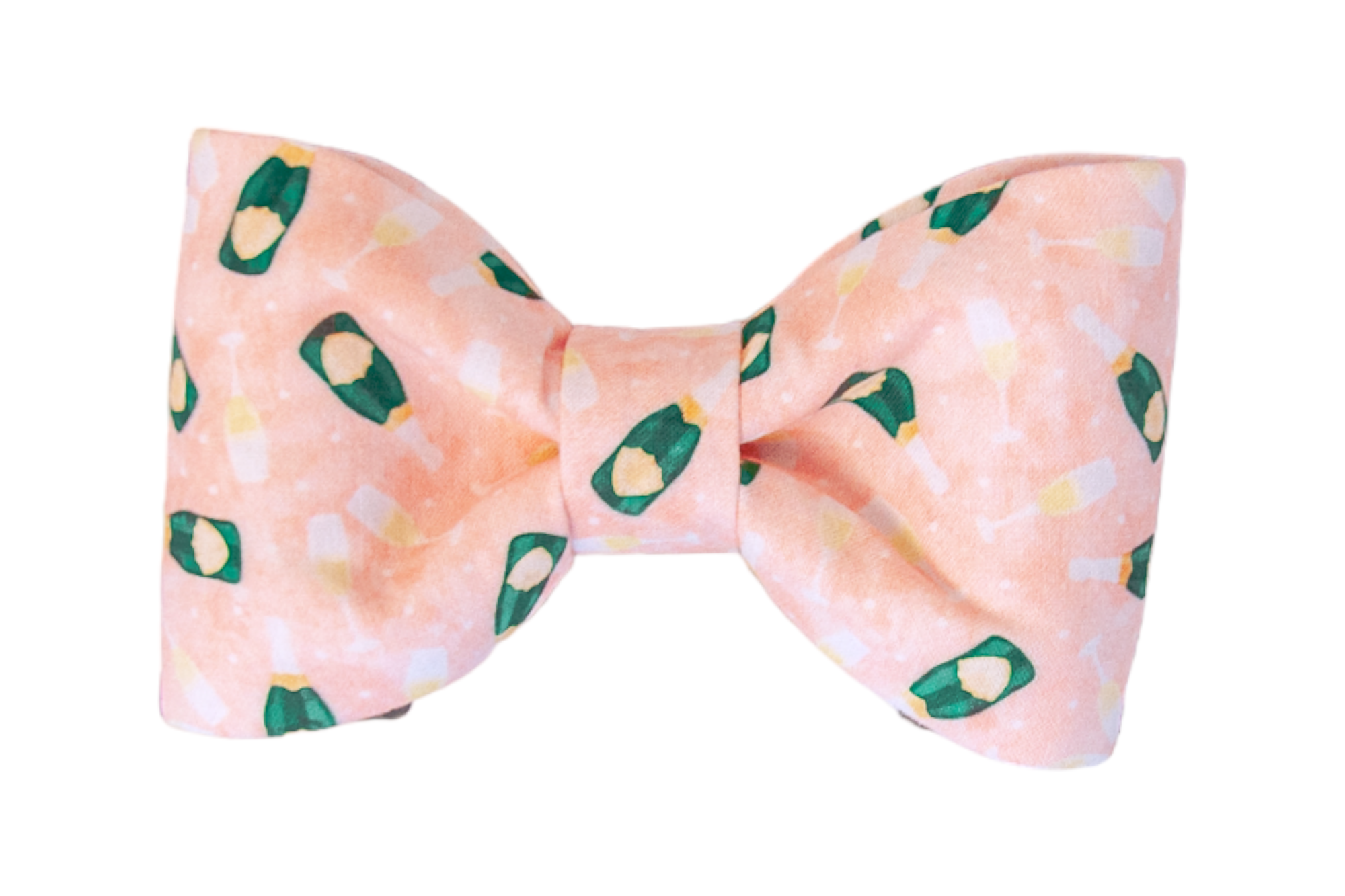 A structured dog bow tie made of soft pink fabric printed with a festive pattern of green champagne bottles and golden glasses filled with bubbly. The print is scattered evenly across the fabric, creating a cheerful celebratory vibe. The bow is neatly folded with symmetrical loops and a cinched center knot, designed to attach securely to a dog collar.