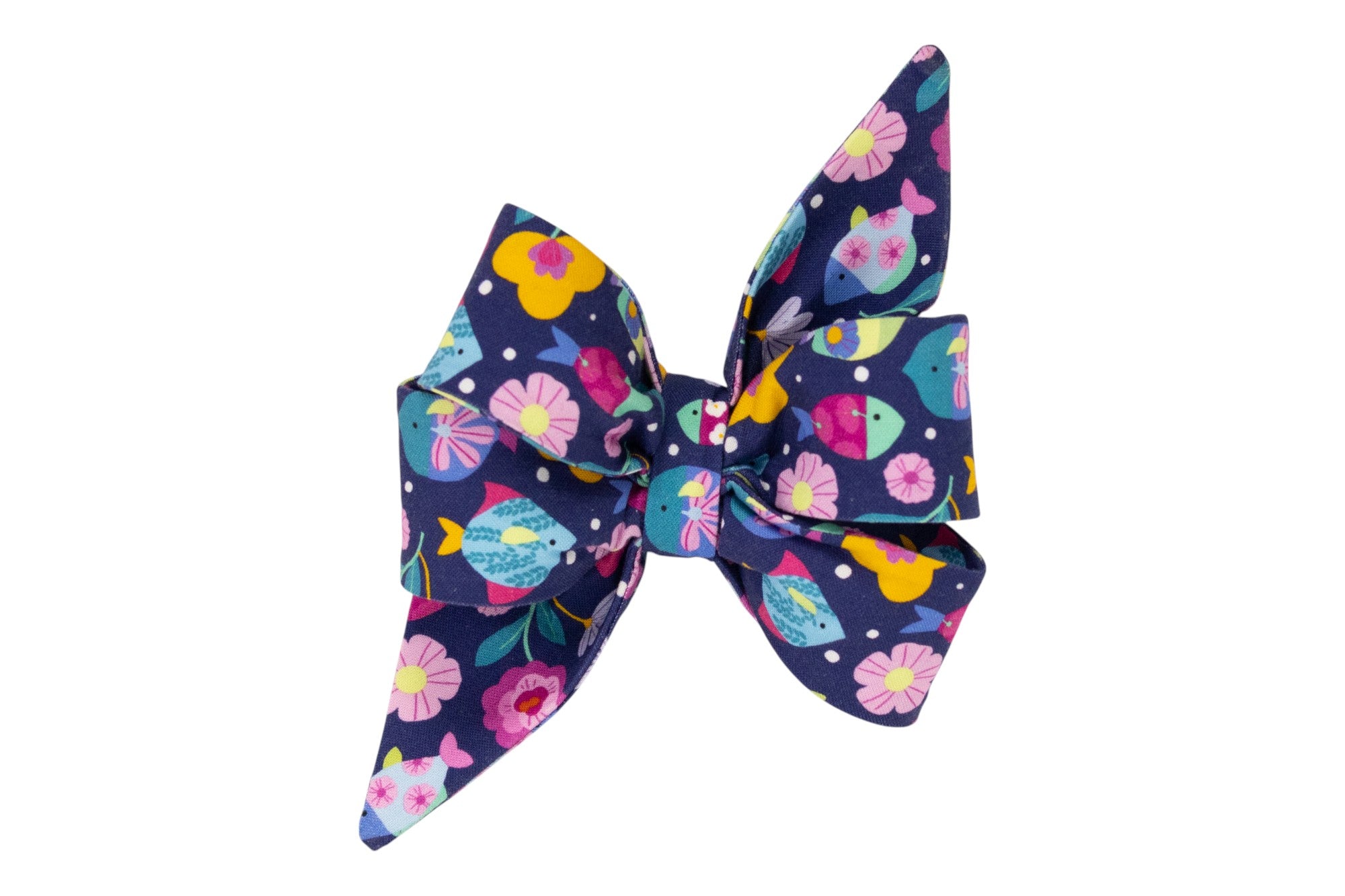 Close-up of a navy blue girl belle bow featuring a whimsical print of multicolored fish, blooming flowers, and dotted accents. The pattern is lively and eye-catching.