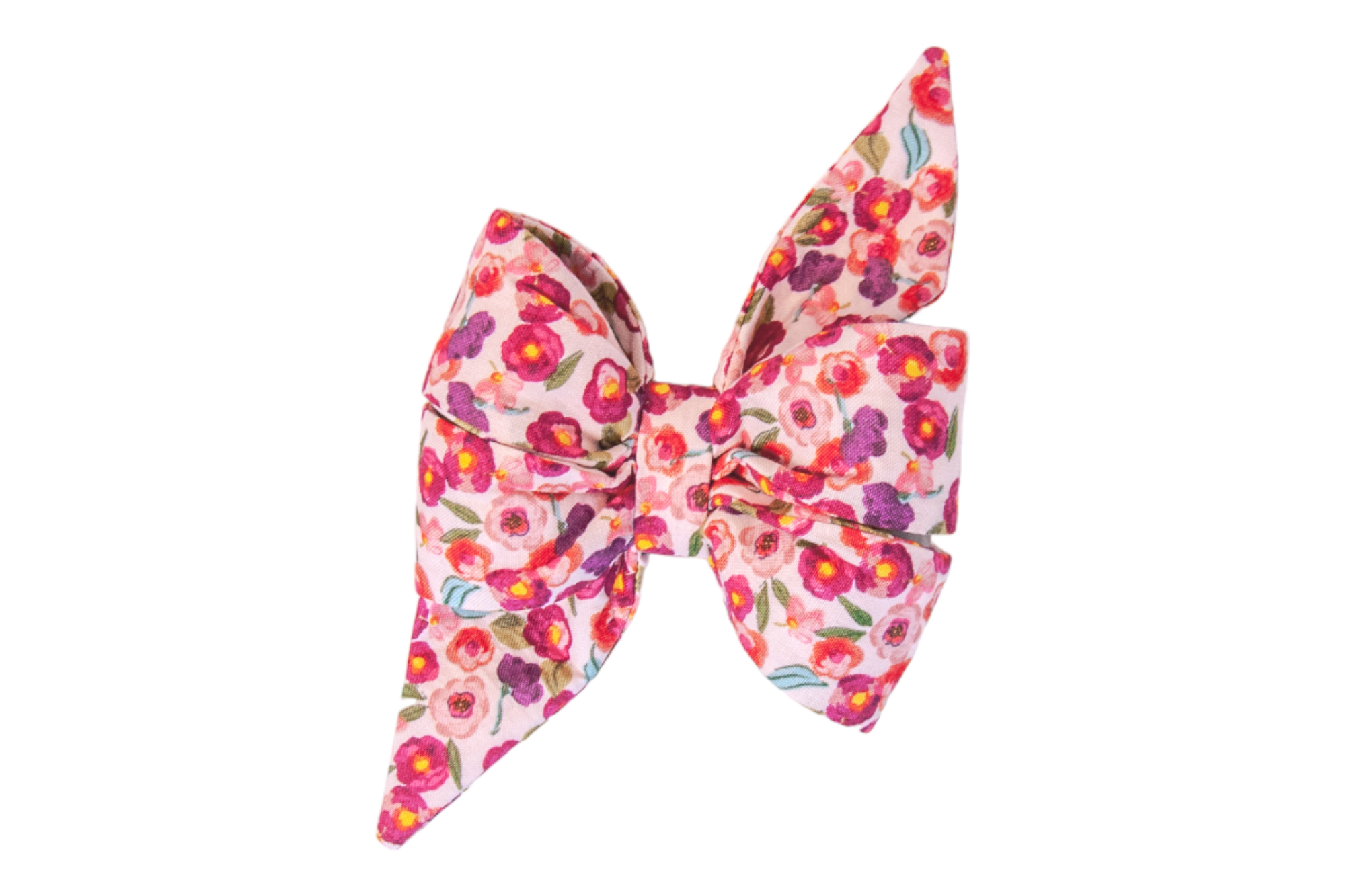 Structured dog belle bow made from cotton fabric with vibrant small flowers and leaves on a pale pink background. The belle bow has two tall, pointed loops and wide, layered lower sections, giving it a bold, feminine appearance.