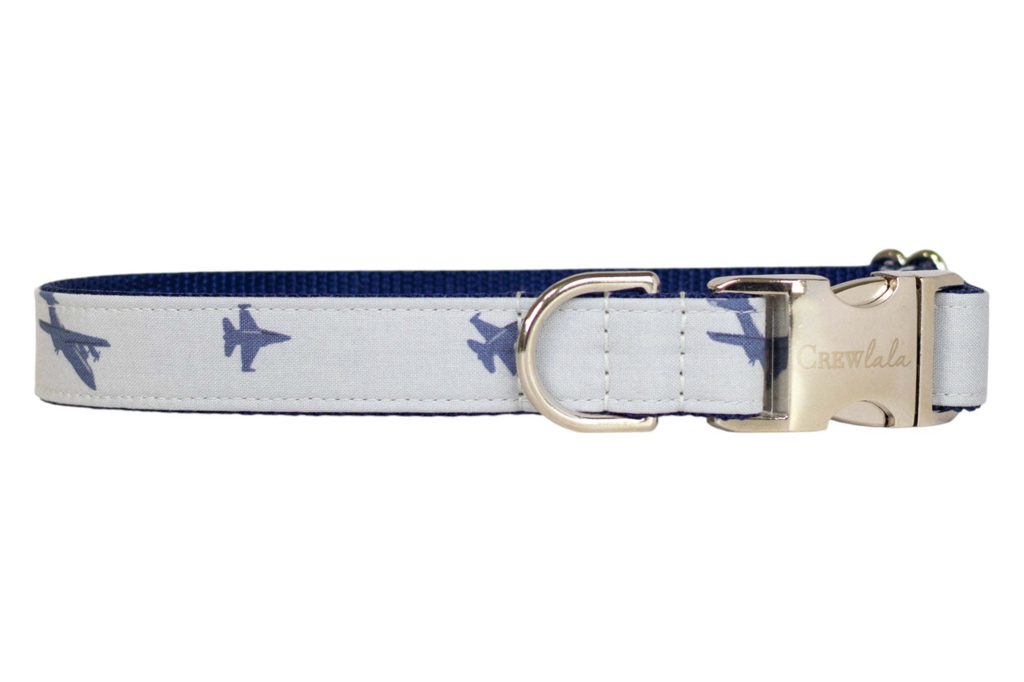 A gray dog collar decorated with navy blue fighter jet silhouettes, lined with navy blue webbing. The collar is equipped with a silver-tone D-ring and a silver buckle.