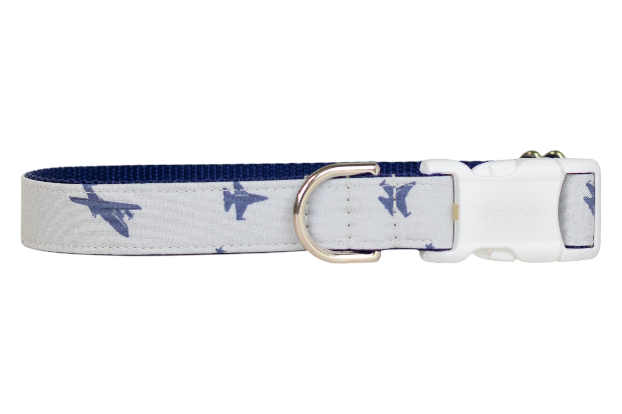 A gray dog collar decorated with navy blue fighter jet silhouettes, lined with navy blue webbing. The collar is equipped with a silver-tone D-ring and a white buckle.