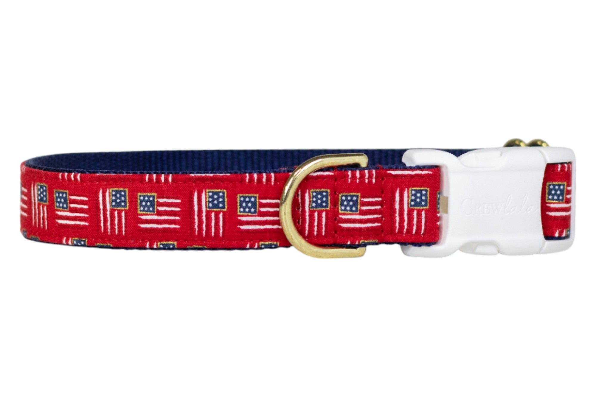Patriotic-themed red dog collar with miniature American flags throughout, paired with a navy blue underside, a sturdy white buckle, and a gold metal D-ring for leash attachment.