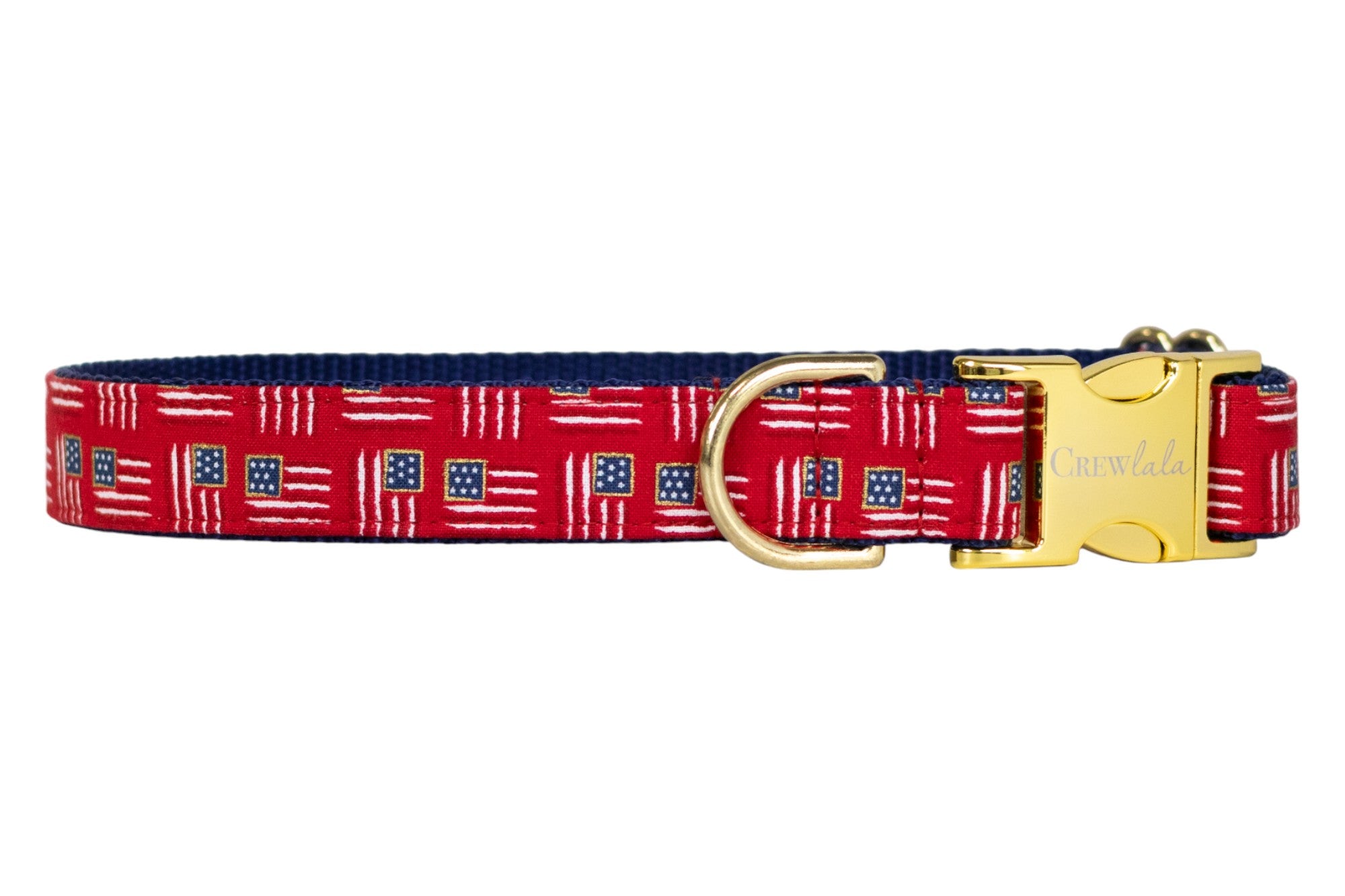 Patriotic-themed red dog collar with miniature American flags throughout, paired with a navy blue underside, a sturdy gold buckle, and a gold metal D-ring for leash attachment.