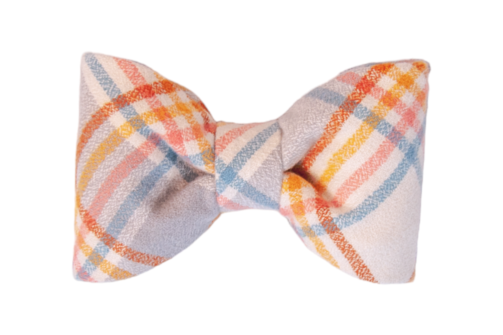A classic fabric bow tie in soft flannel material with a pastel plaid pattern. The bow tie is symmetrical, featuring intersecting stripes in warm and cool tones, giving it a cozy, seasonal appearance.