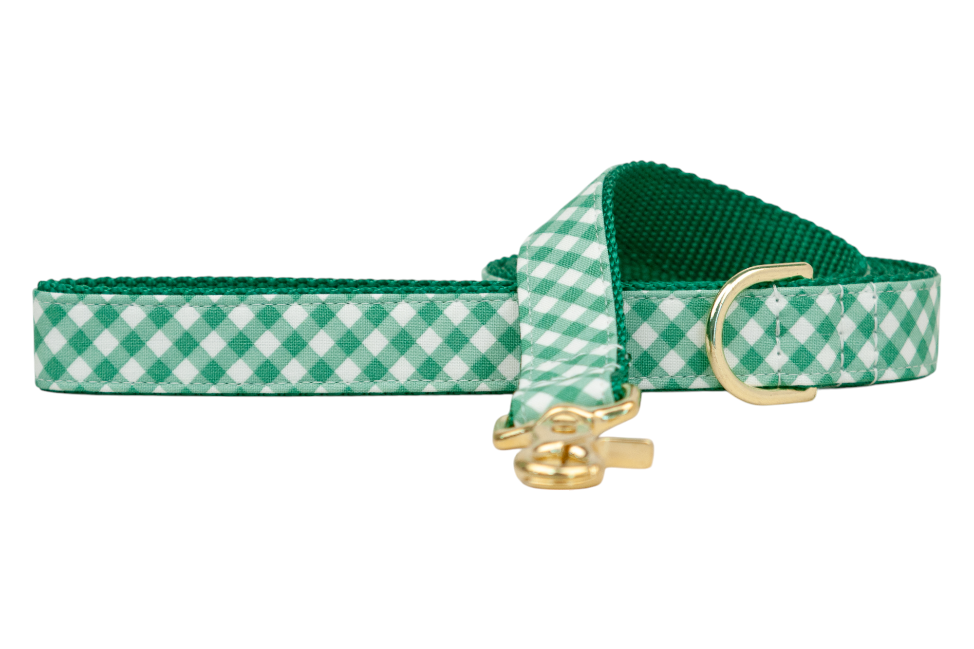 A green and white gingham-patterned leash for dogs, designed with a solid green underside and clean stitched borders. The leash features a polished gold-tone clasp and D-ring, blending a preppy pattern with elegant metal accents.
