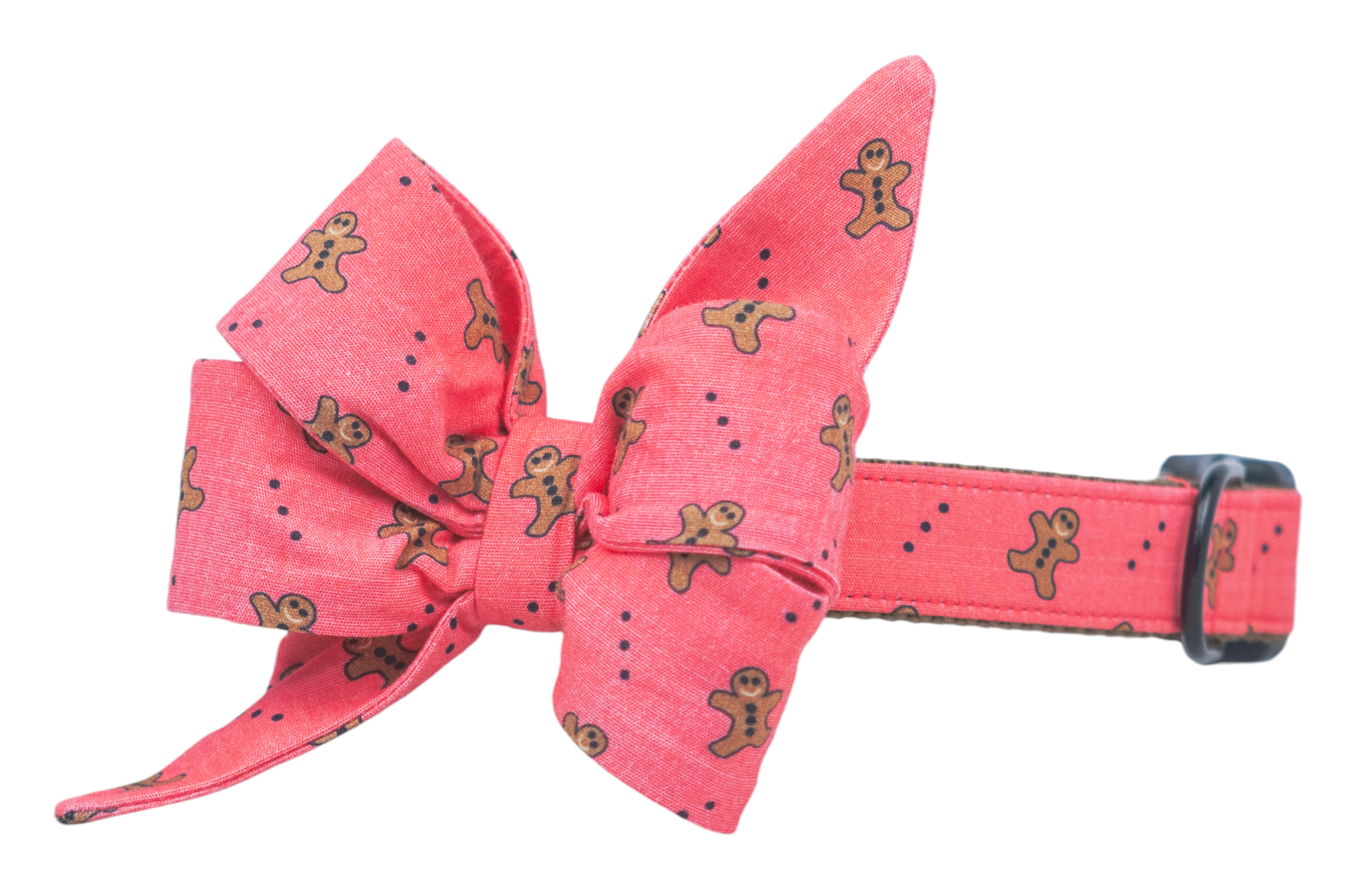 Sweeten your dog’s look with this adorable collar and dramatic belle bow set, sprinkled with gingerbread men and dots on a red background. The perfect accessory for pups who prefer their holiday style with a little extra flair!