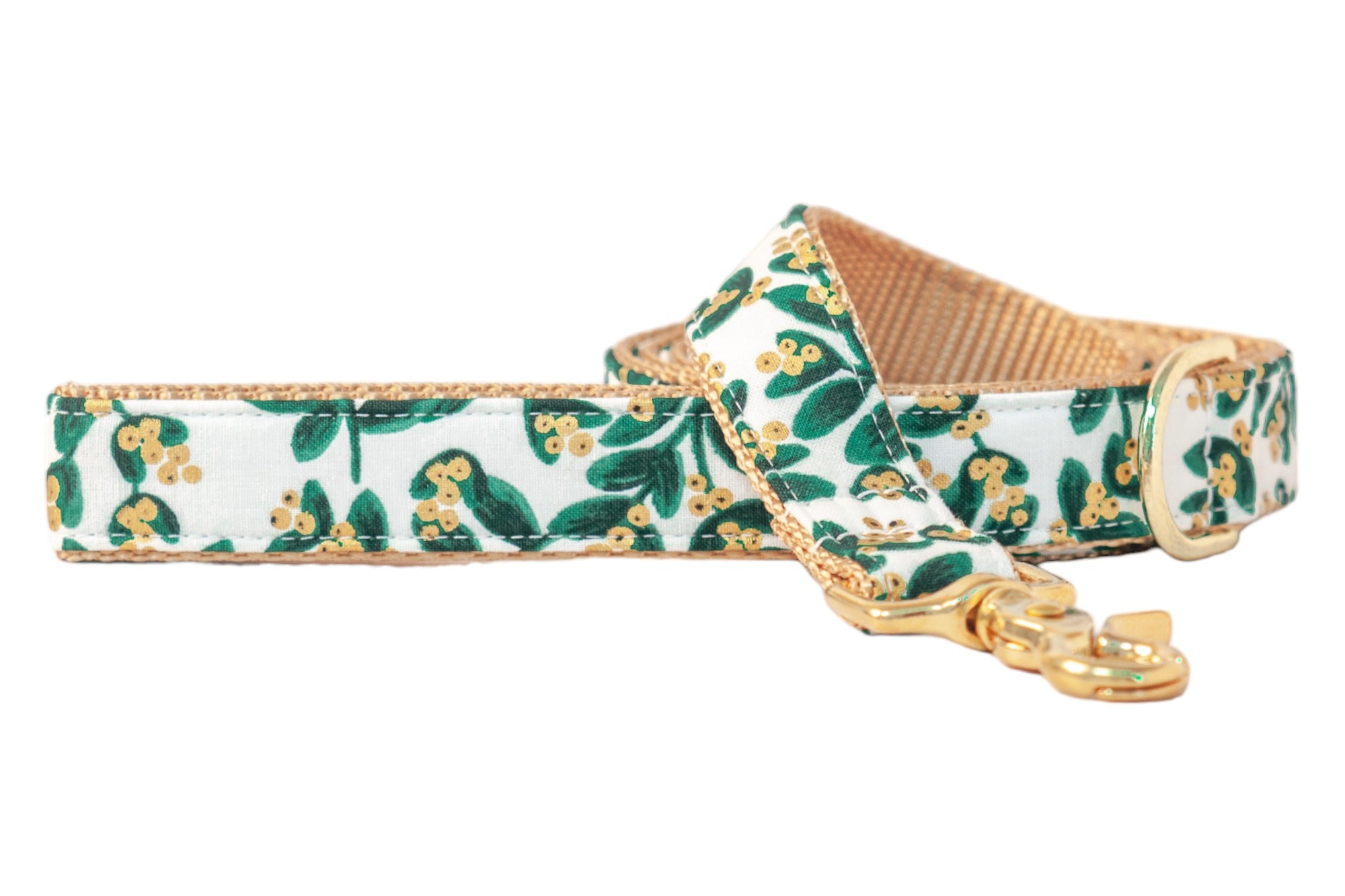 Elegant holiday dog leash with a crisp light background, decorated in a mistletoe pattern of rich green leaves and metallic berries, finished with polished hardware for a chic winter walk.