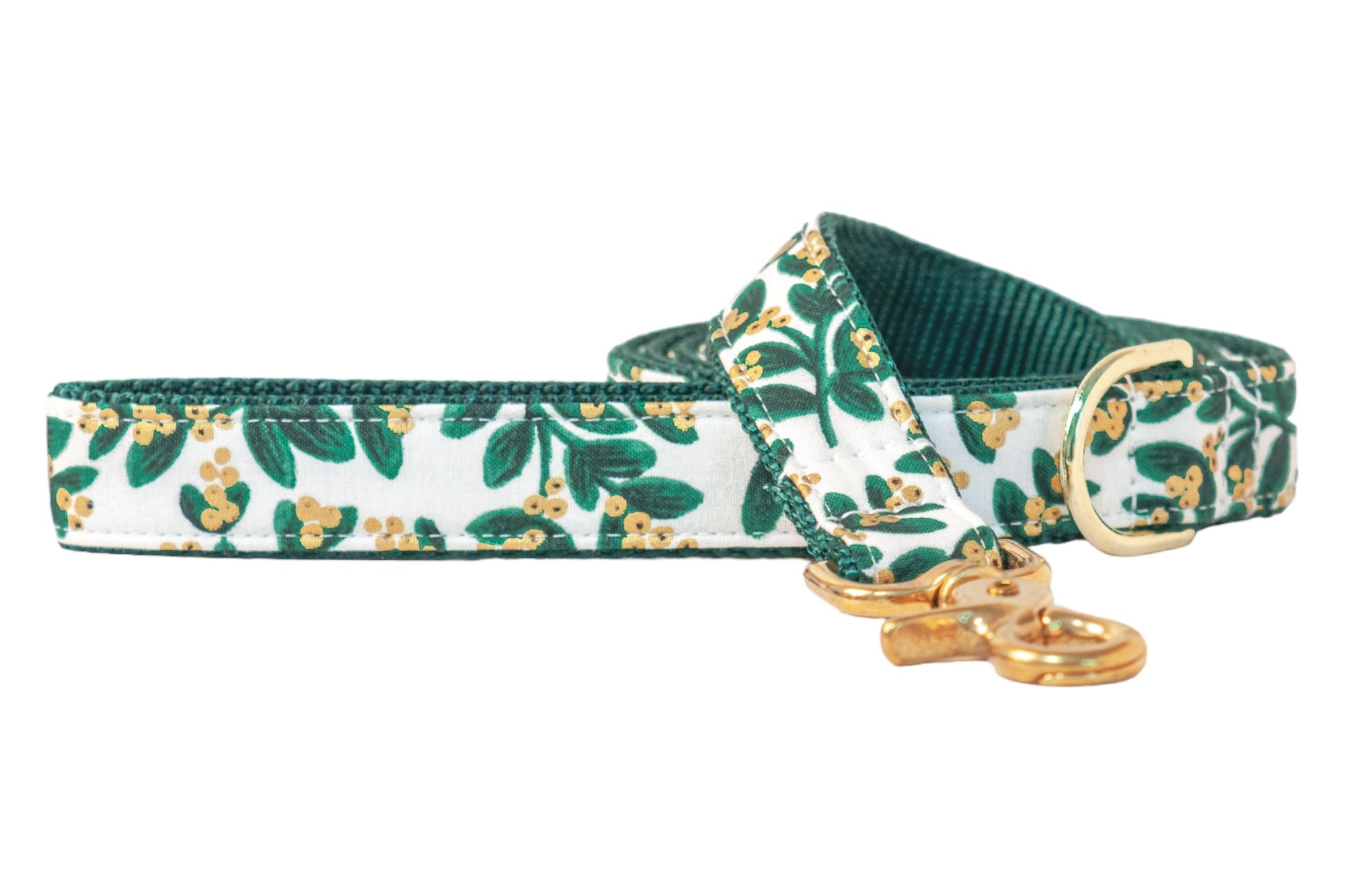 Elegant holiday dog leash with a crisp light background, decorated in a mistletoe pattern of rich green leaves and metallic berries, finished with polished hardware for a chic winter walk.