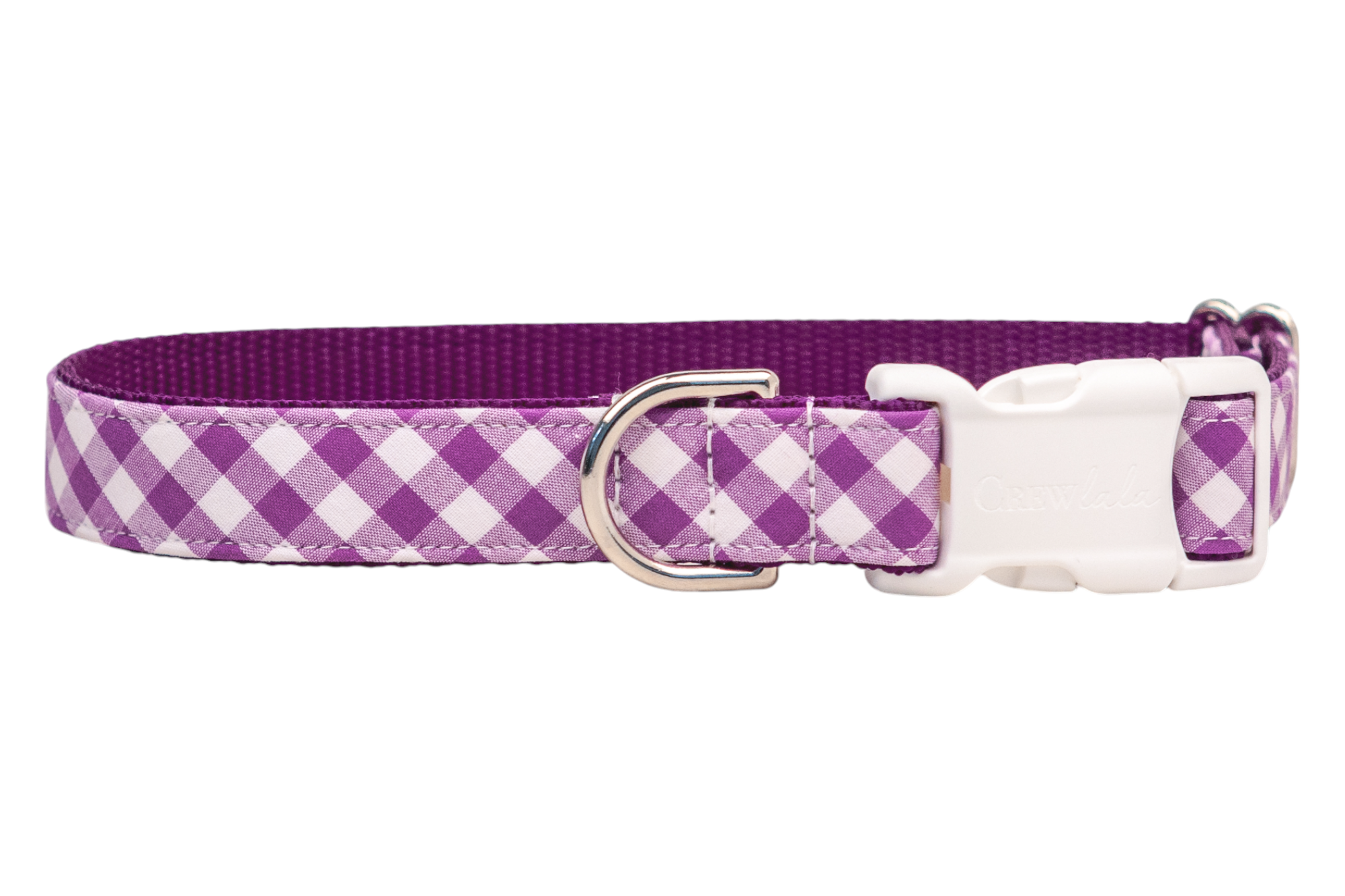 Purple picnic plaid dog collar made from woven nylon with a soft fabric outer layer. The design includes a sturdy buckle, a shiny D-ring positioned beside it, and double-stitched detailing for strength. The interior is textured for comfort and grip.