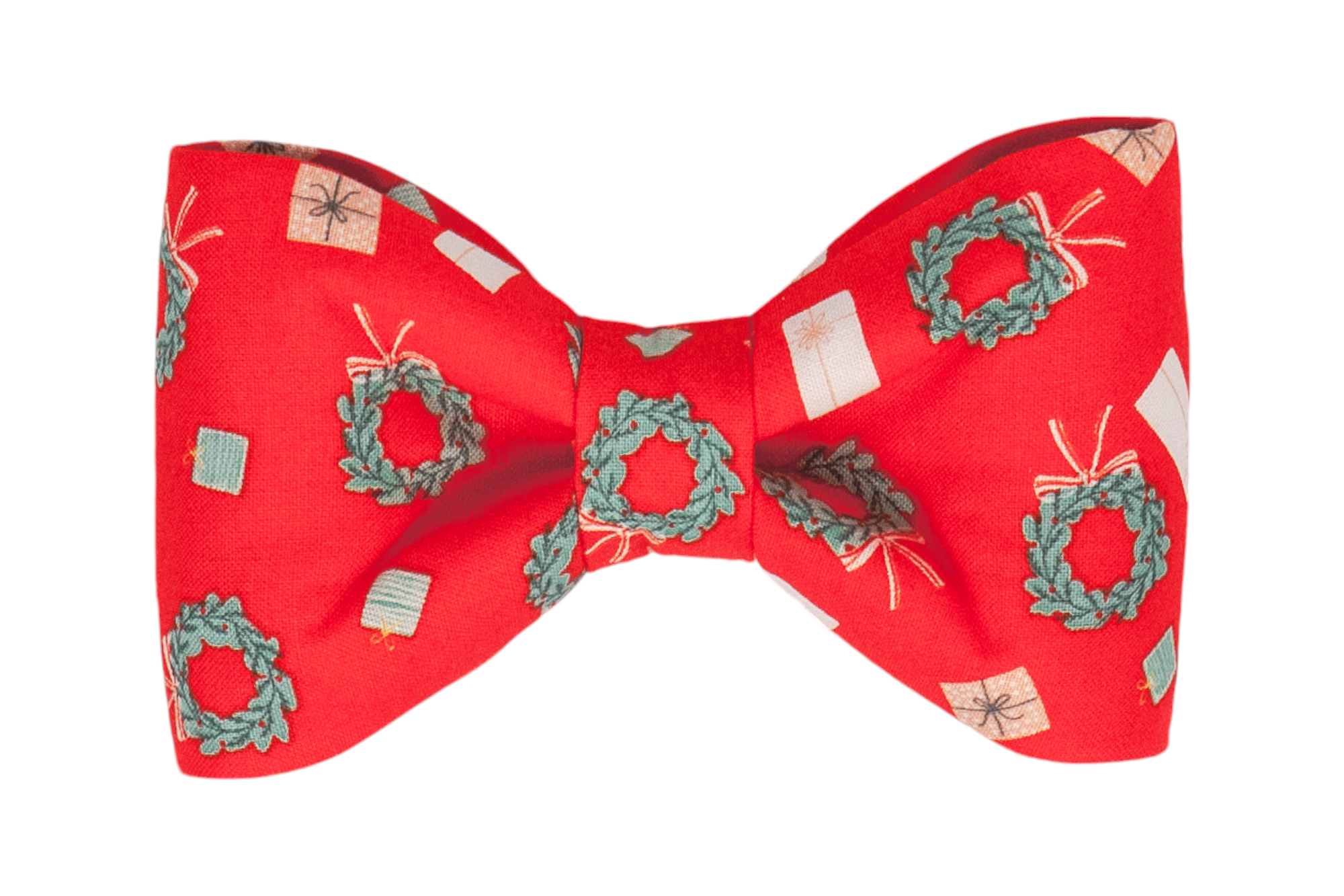 Christmas-themed dog bow tie made from vibrant red fabric printed with miniature gift boxes and wreaths. The bow tie has soft curves and a gathered center, creating a cheerful, polished look for holiday celebrations.