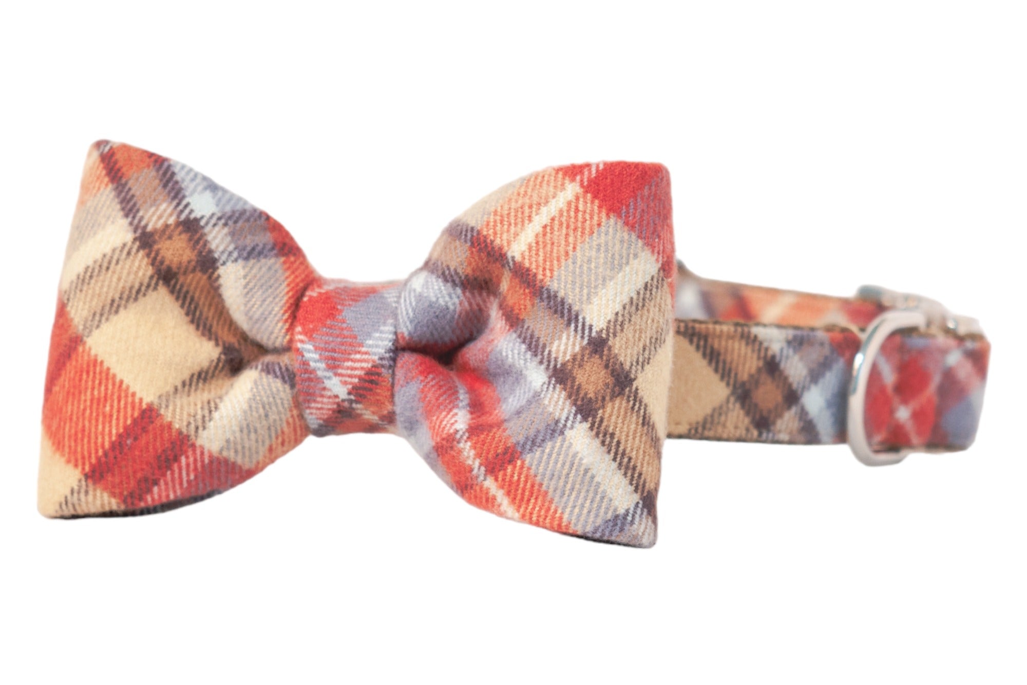 Adjustable dog collar made from soft flannel in a warm plaid pattern, featuring a matching bow tie with two puffed loops and a tightly cinched center band, attached securely to the collar and metal hardware.