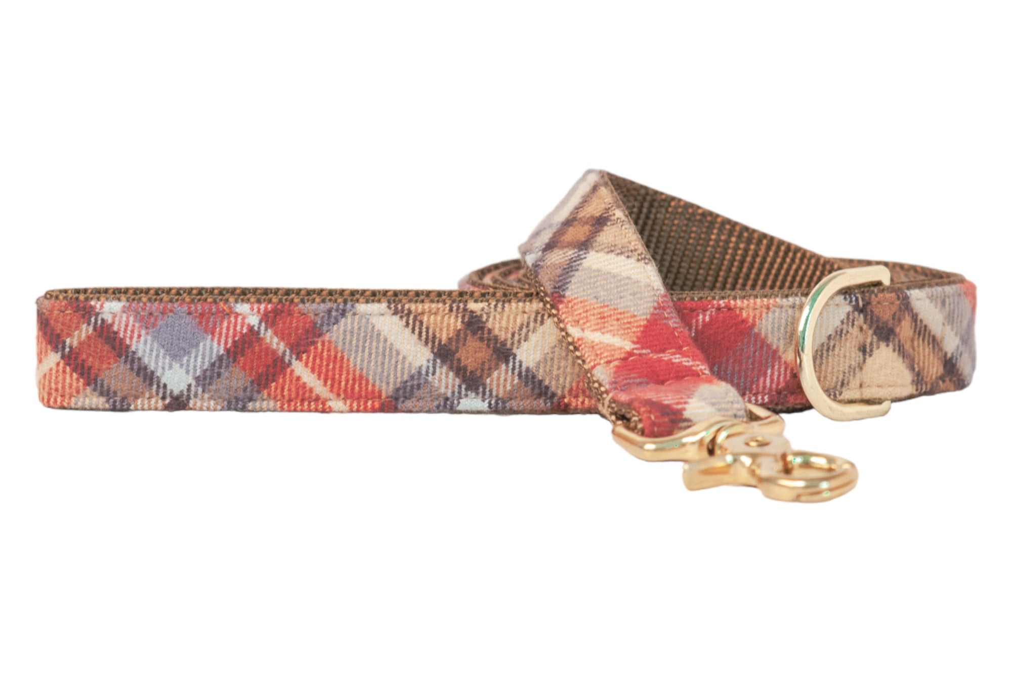 Plaid dog leash in shades of autumnal hues, made from flannel with reinforced stitching and polished metal fittings.