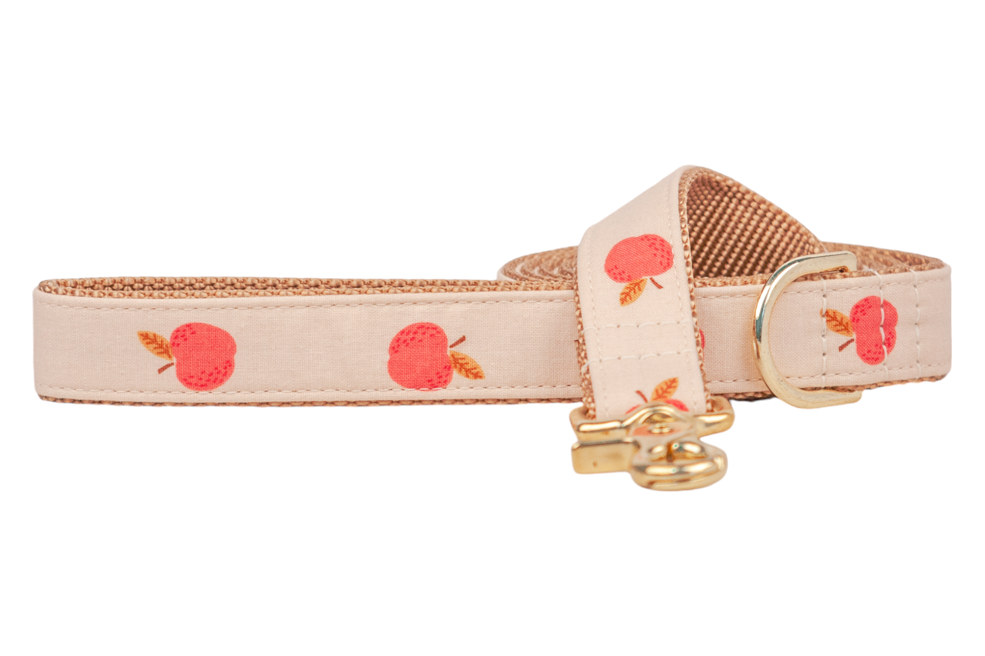 Neutral dog leash with classic red apple illustrations and metal hardware, backed with tightly woven tan webbing for strength and comfort. Handmade in Charleston, SC.