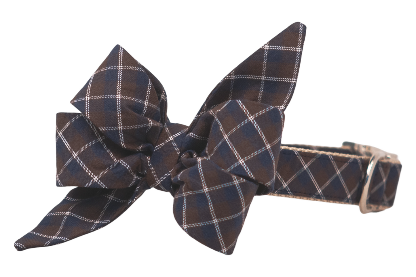 Elegant dog collar with a matching, large, feminine belle bow composed of multiple folded and pointed loops in a navy blue and brown argyle plaid print. The collar includes nylon webbing and a sturdy silver metal buckle, and a D-ring for leash attachment.
