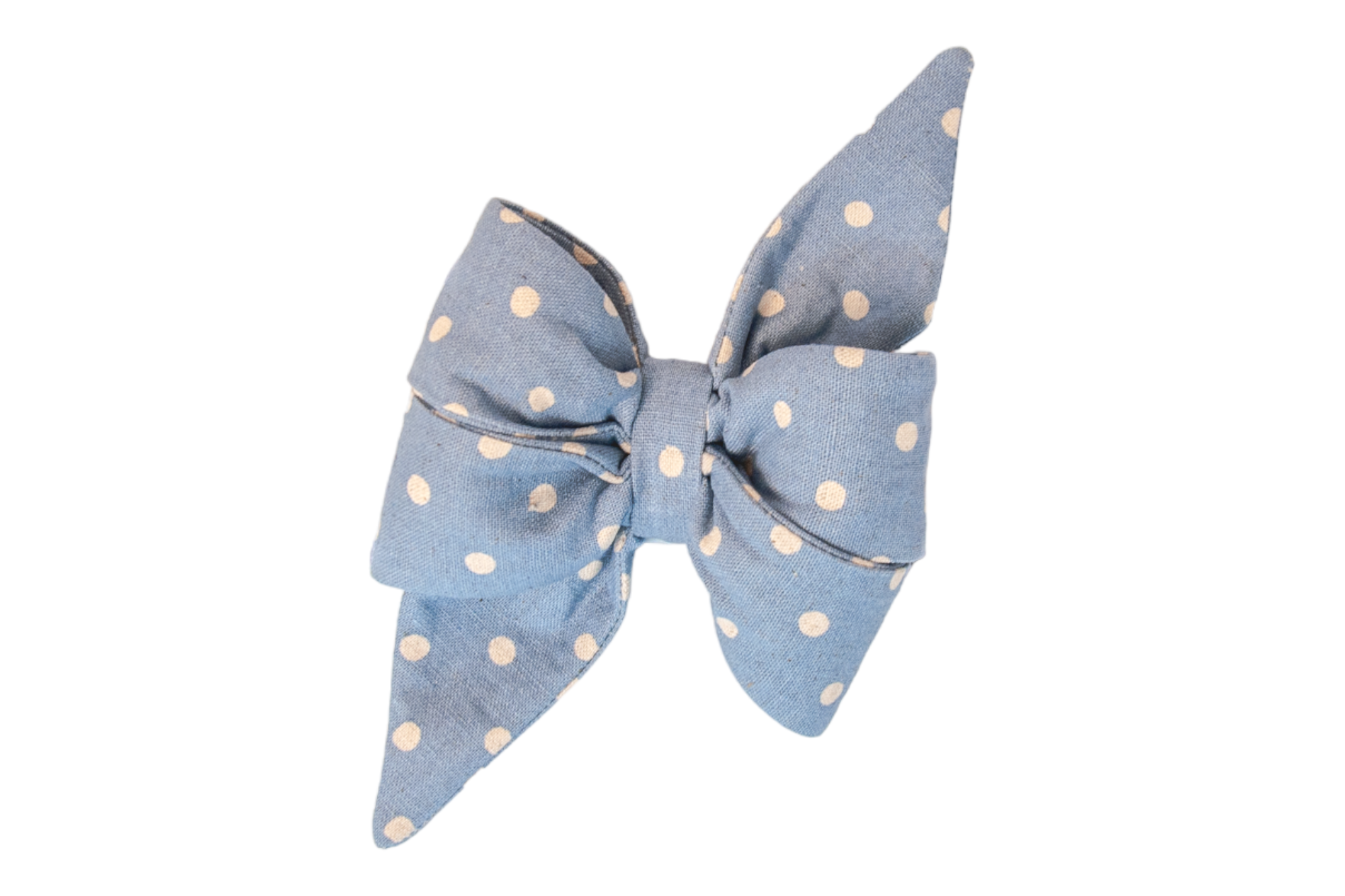 Charming dog belle bow made of chambray-like light blue fabric with white polka dots, designed with two large loops and long, tapered tails for a fun, feminine look.