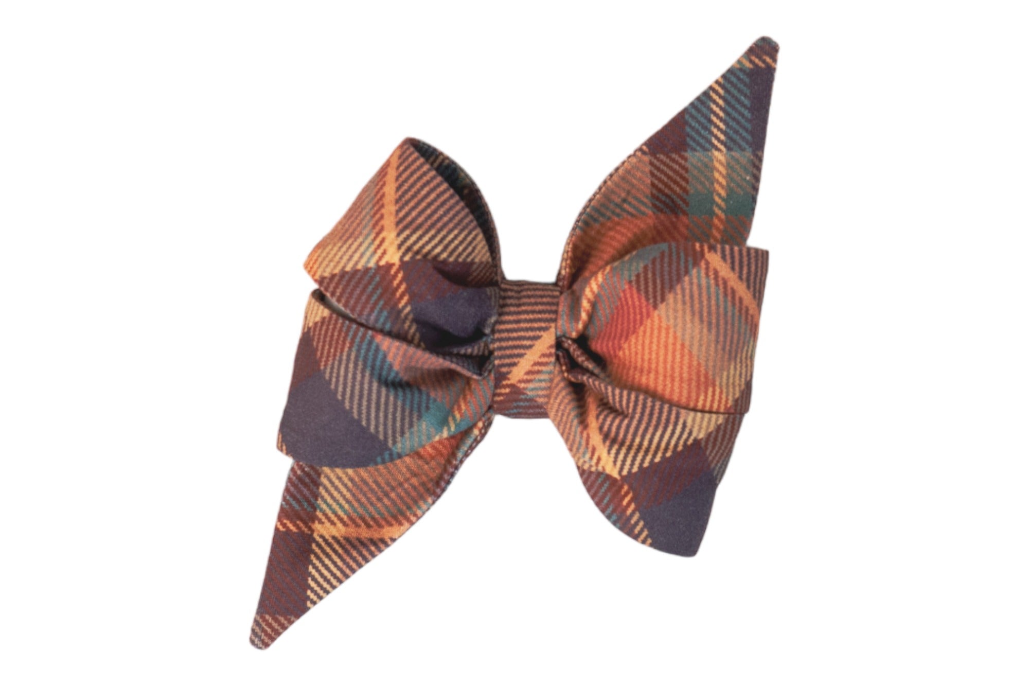 A large, fabric belle bow with exaggerated pointed tails and sculpted loops, made from plaid material in warm fall colors. The diagonal plaid pattern adds texture and depth, with crisp folds and a neatly cinched center.