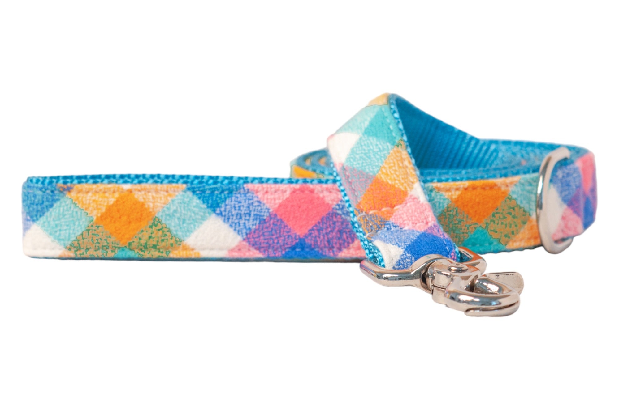 A cheerful dog leash in pastel plaid with pink, orange, and blue tones, paired with shiny hardware — perfect for pups who like to walk on the bright side.
