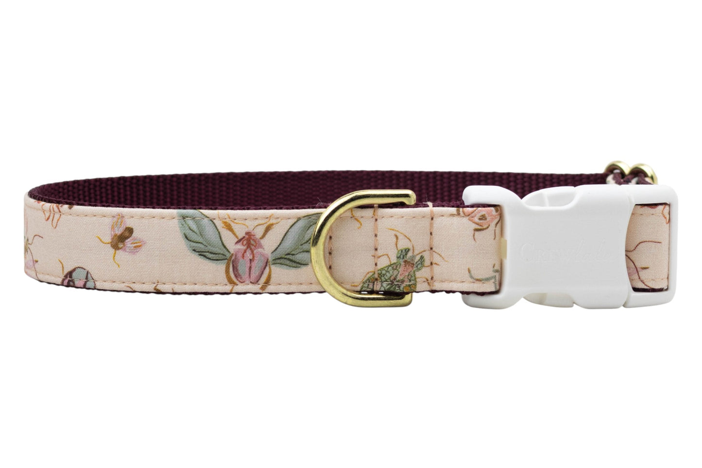 Turn daily walks into a fashion moment with this charming dog collar, decked out in pastel bugs and blossoms, topped with sturdy accents and Crewlala style.