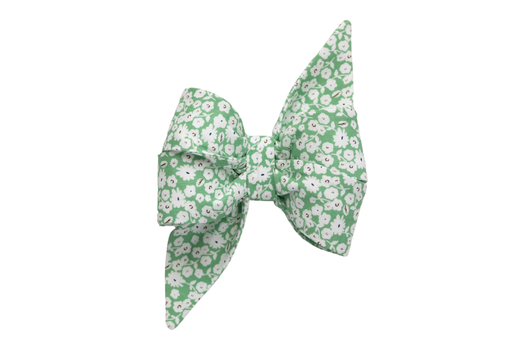 Handcrafted floral girl belle bow for dogs, showcasing a soft green canvas sprinkled with petite white blooms.