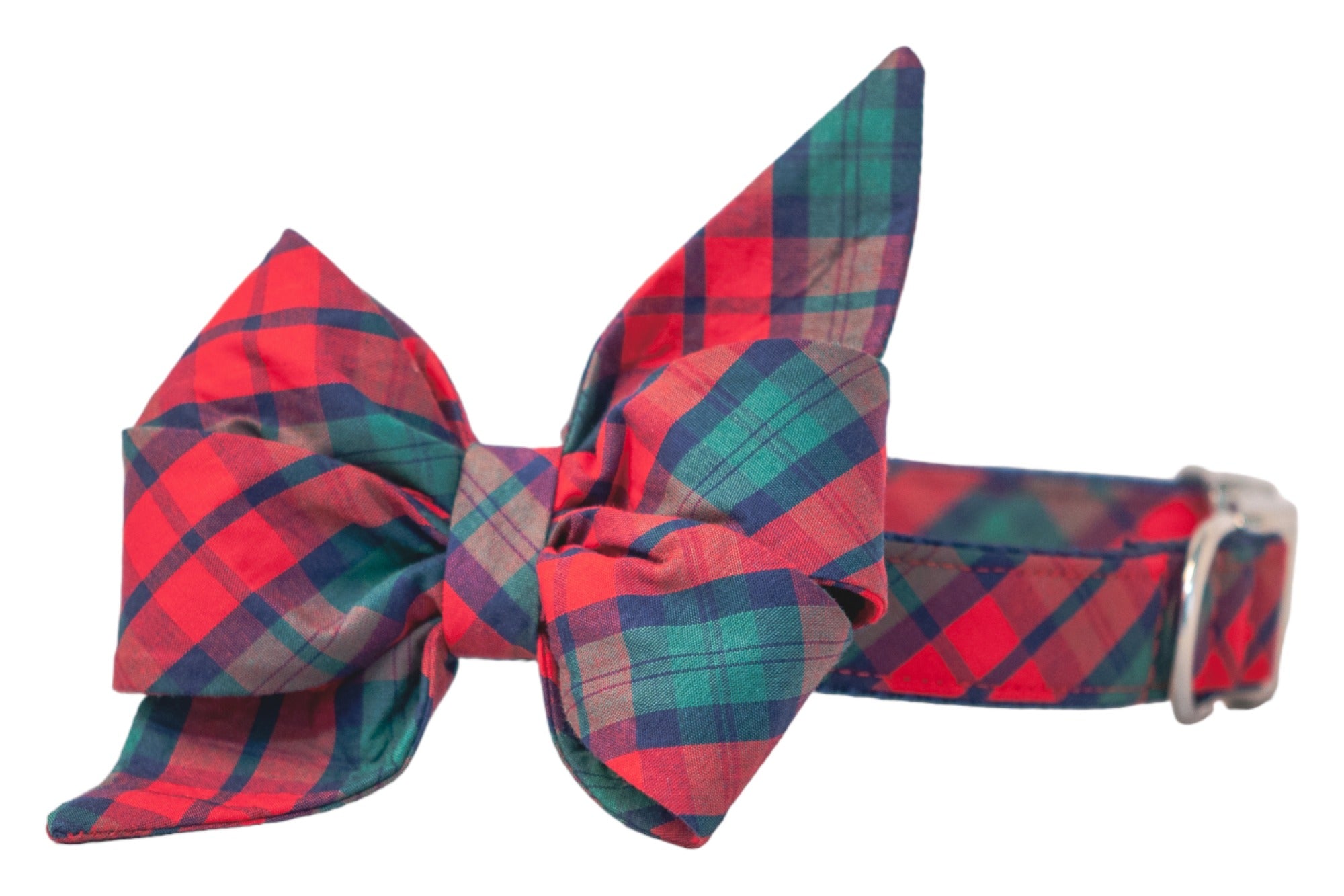 A festive dog collar adorned with an oversized plaid belle bow in classic holiday hues. The bow is double-layered with structured loops and long, pointed tails, giving it an elegant flair.