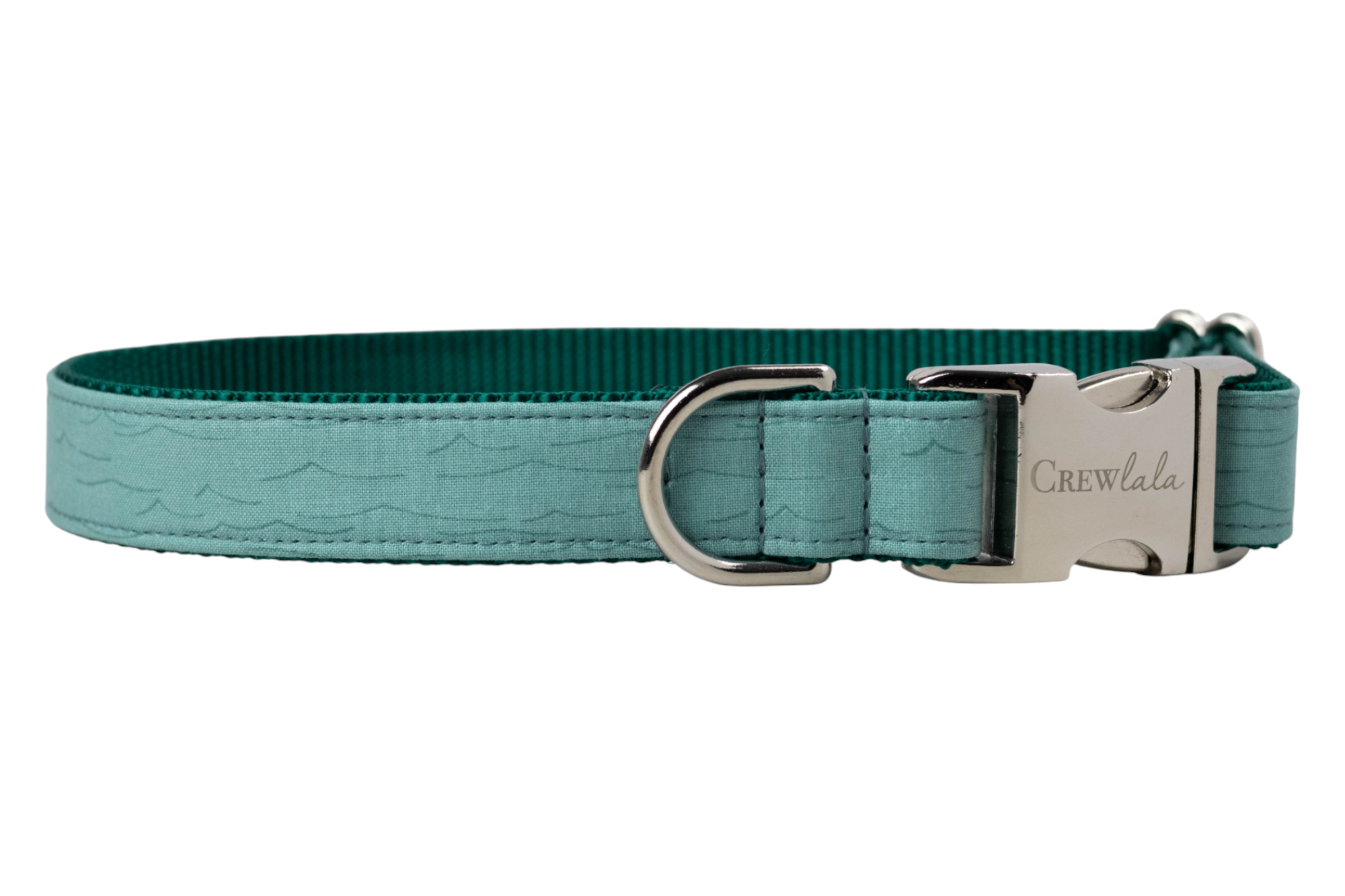 Minimalist teal dog collar made from fabric with a soft ripple wave pattern, finished with polished silver hardware and a dark teal webbing interior.